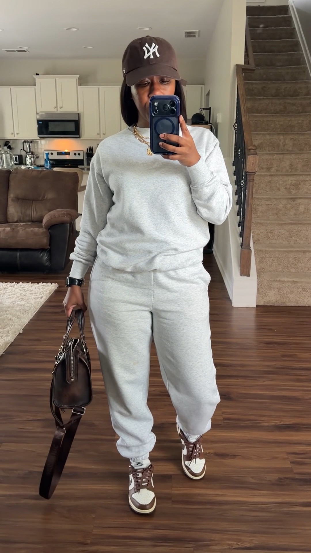 Grey pullover sweatshirt and matching grey jogger sweatpants. I styled this comfy outfit with a brown hat, brown satchel bag, and Nike dunk low cacao wow sneakers 

#LTKOver40 #LTKootd #LTKPetite