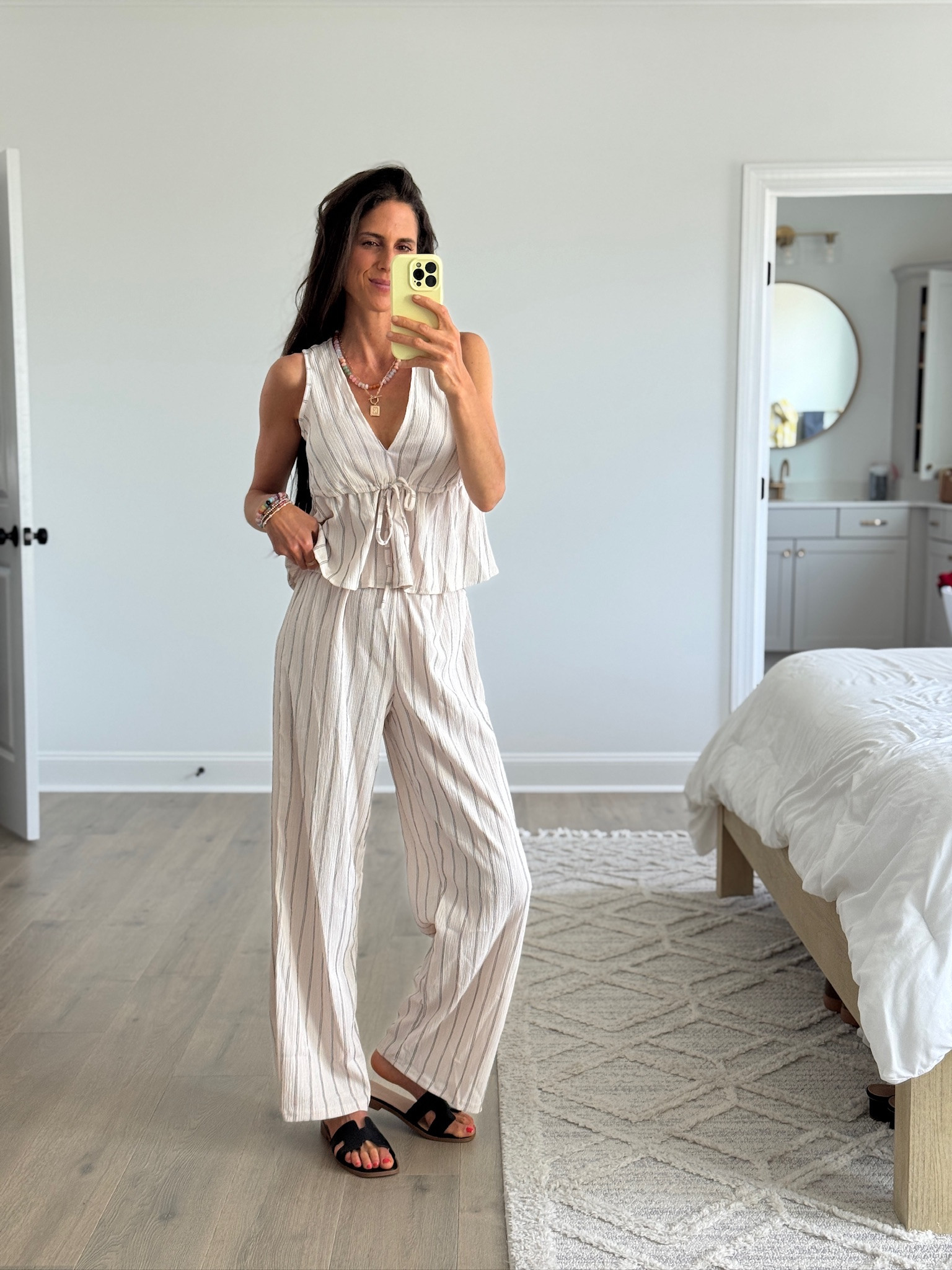 Neutral matching set you’ll live in this summer. Lightweight striped tank and wide leg pants that are breathable, flattering, and perfect for travel days, errands, or casual everyday wear.

#LTKSeasonal #LTKootd #LTKdayinmylife