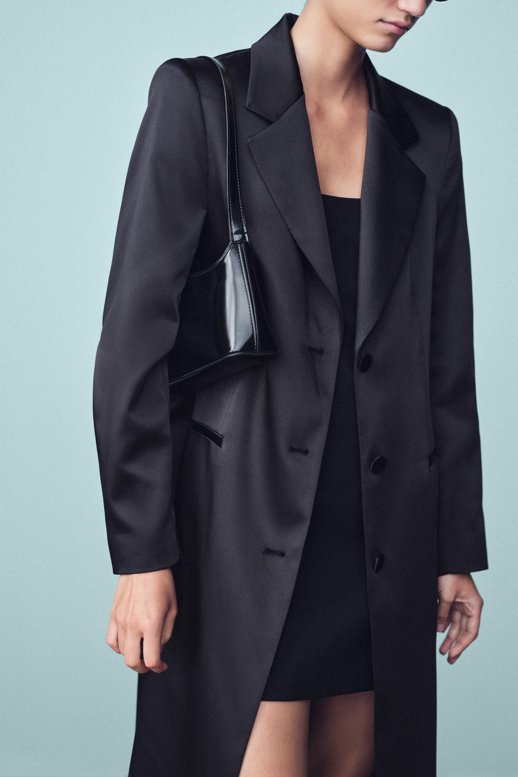 Coat with a lapel collar and long sleeves with shoulder pads. Features welt front pockets and a b... | Zara US