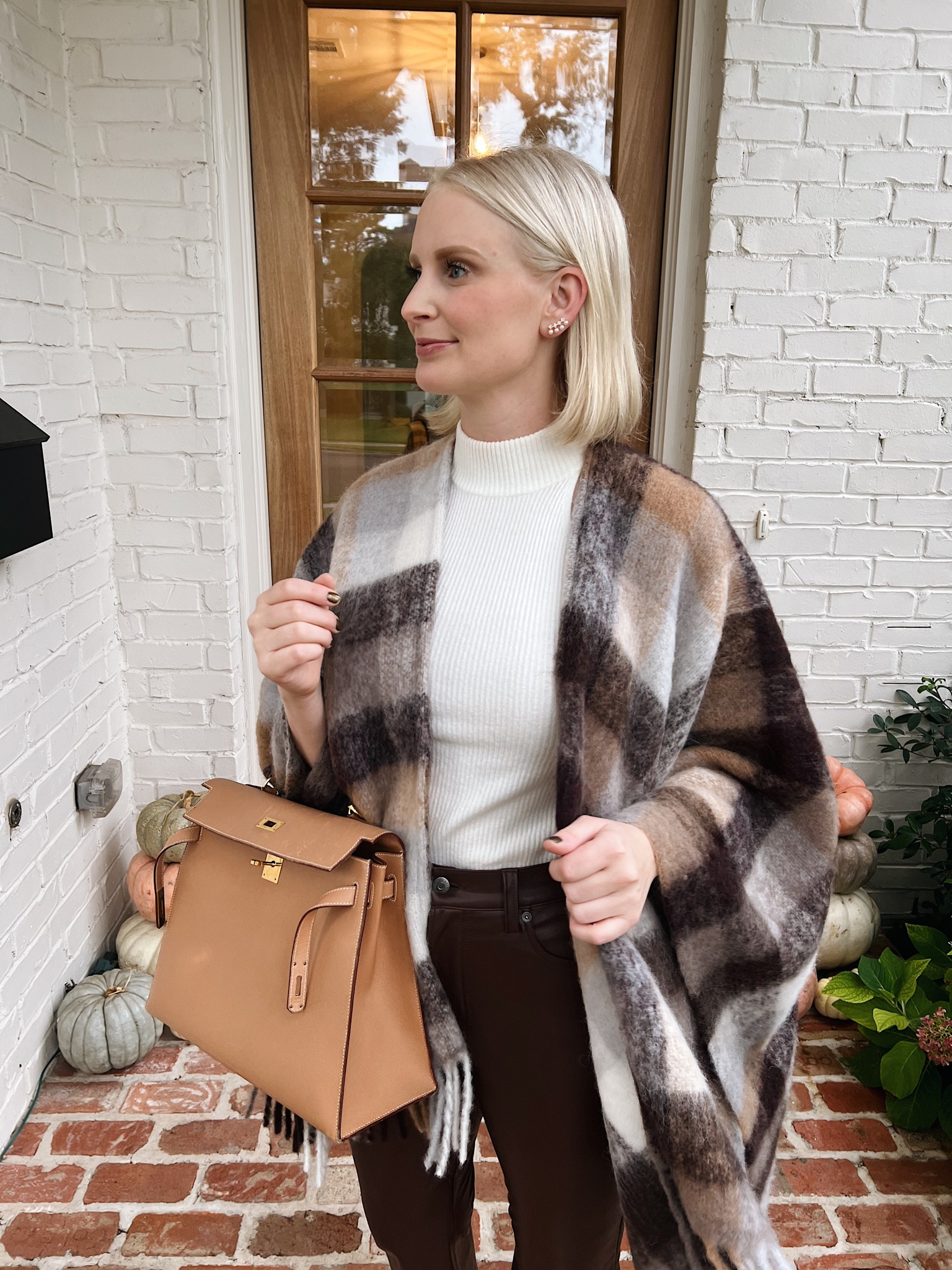 Serving some Thanksgiving outfit inspo with this look from @saks! This neutral check poncho is a chic + cozy layer to throw over all kinds of outfits this season. I styled it with brown faux leather pants that are so good I bought them in black too 🙌🏻 Shop my outfit and more Thanksgiving ready finds over on the LTK app 🦃 #Saks #SaksPartner

#LTKstyletip #LTKSeasonal #LTKHoliday