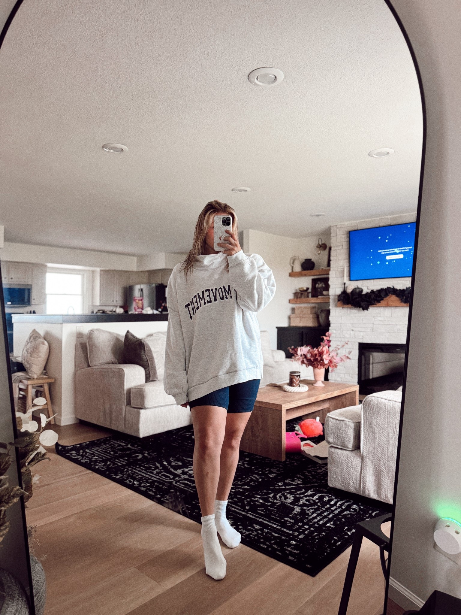 Free People oversized sweatshirt styled with biker shorts — the ultimate casual chic outfit. Shop my exact look + similar comfy faves here 🖤 #FreePeople #AthleisureStyle #OOTD