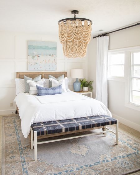 Loving the coastal decor vibes in our prior guest bedroom! Items include this cane bed frame, woven nightstand, blue gray ceramic lamp, wood bead chandelier, navy blue woven bench, beach art, faux fern and hand-knotted rug! It all pairs perfectly with these Pottery Barn and Serena & Lily pillows!

coastal decor, coastal design, neutral decor, blue and white decor, simple decor, bedroom decor, bedroom lighting, bedroom mirror, guest bedroom inspiration, area rug, target chair, amazon home decor, master bedroom decor, pottery barn bed, pottery barn inspired room, coastal bedroom, bedroom bedding,  classic design, simple decorating, target style, bedroom rugs, guest bedroom décor, target home décor, amazon finds, serena and lily bedding, bedroom area rug, master bedroom, guest bedroom, bedroom decorating #ltkhome #ltksalealert #ltkseasonal #ltkunder50 #ltkunder100 #ltkstyletip #ltktravel #ltkfamily 

#LTKFind #LTKsalealert #LTKSeasonal #LTKhome