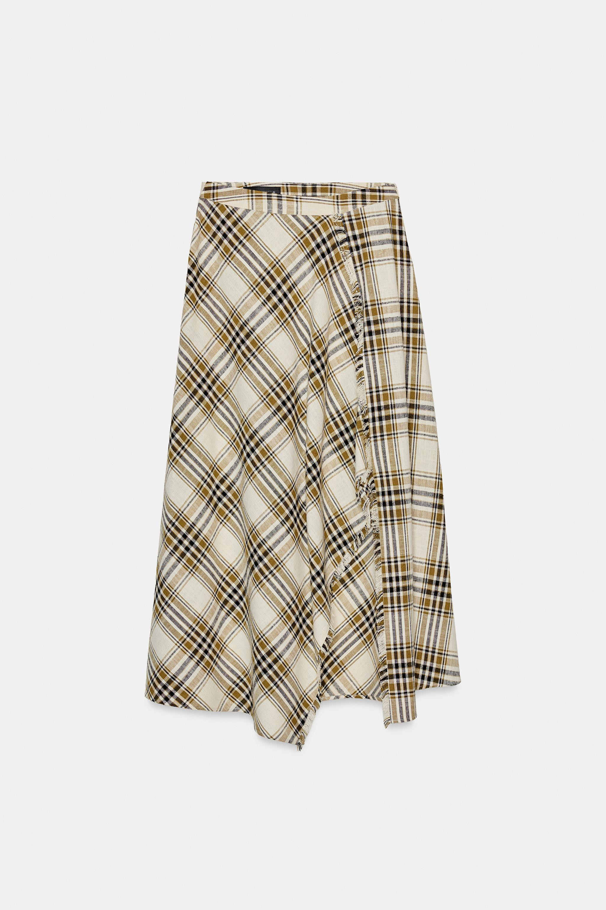 High-waist skirt with an asymmetric hem, front slit and frayed trim. Invisible side zip fastening... | Zara DE