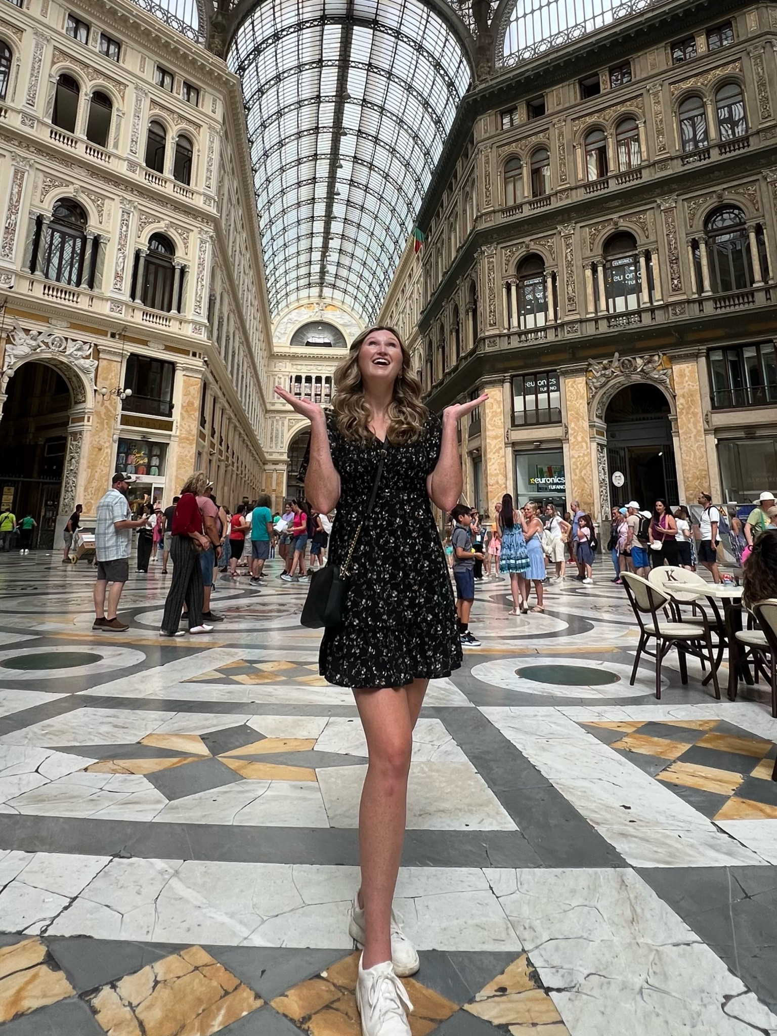 Realistic, affordable Europe summer vacation outfit. Printed floral black Amazon dress with smocked top (tall girl approved), white comfort travel sneakers, black crossbody travel bag 

#LTKTravel #LTKFindsUnder50 #LTKSummerSales