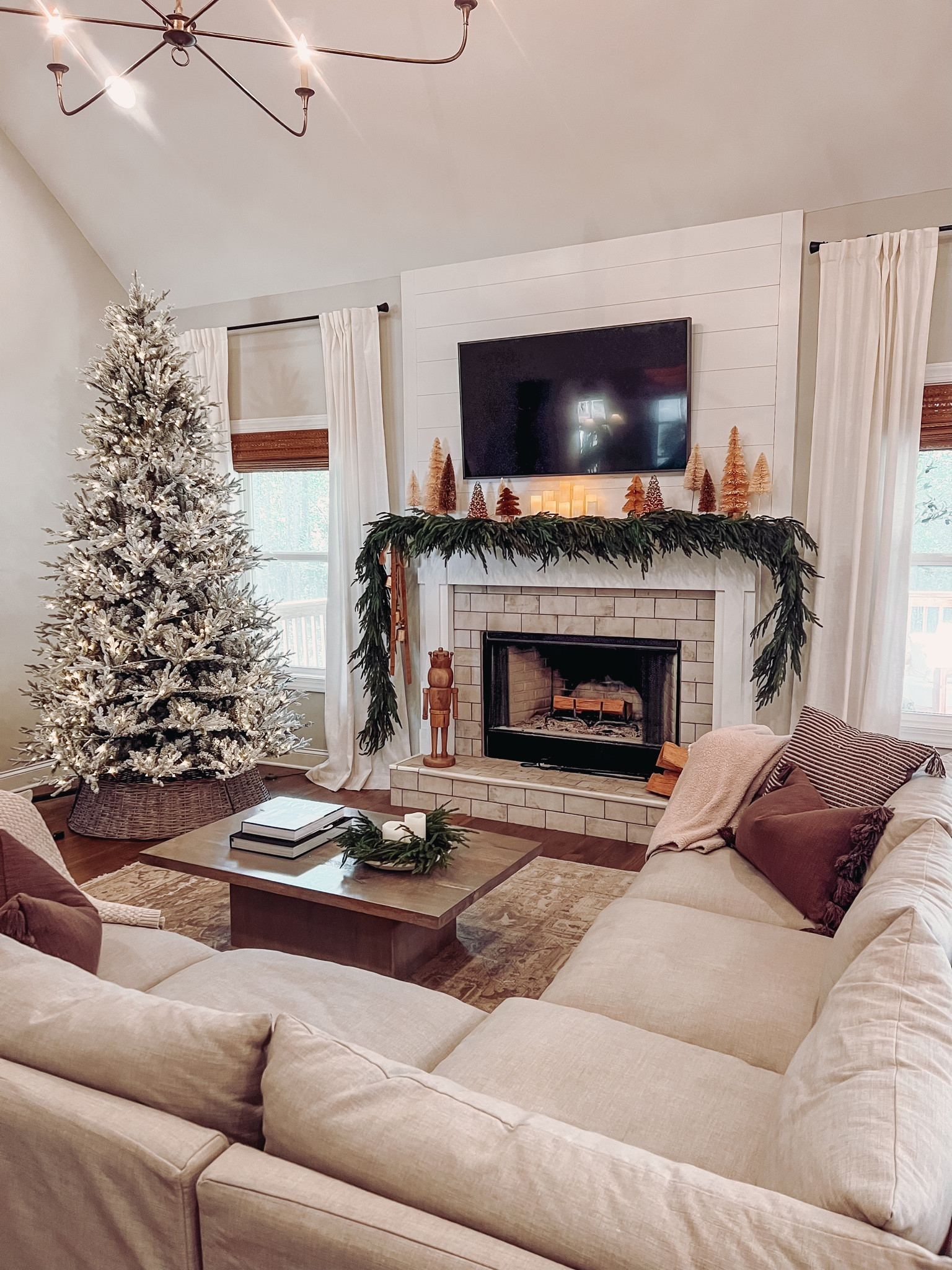 We have the 9.5 ft tree! I used 6 strands of garland on our mantle and our mantle is 7ft wide for reference)

#LTKSeasonal #LTKHoliday