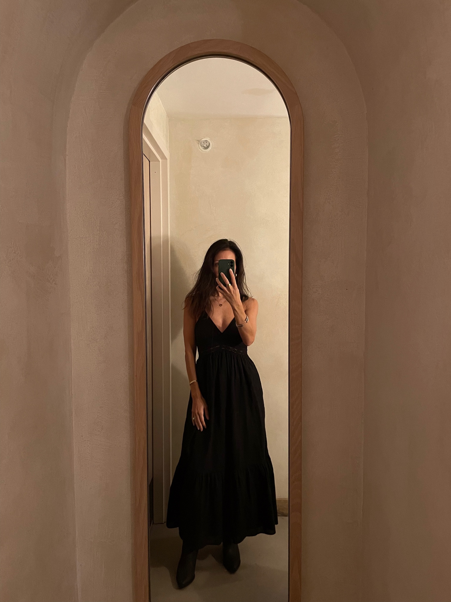 Black maxi dress. Cowboy boots. 