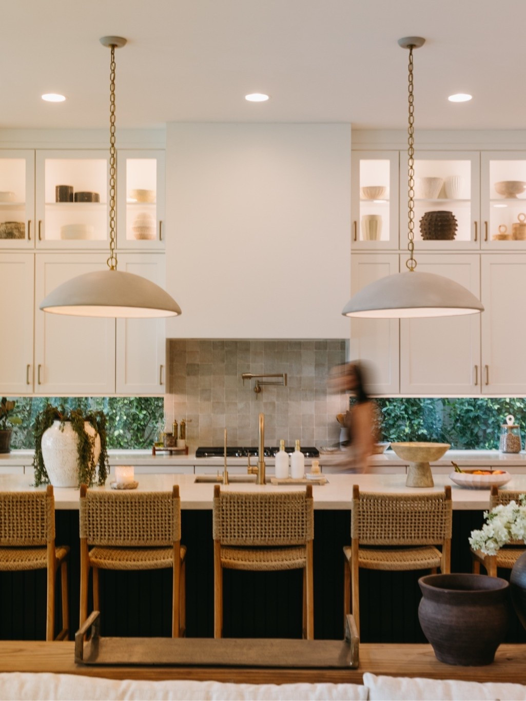 One of my favorite spaces in our home. I’ve always believed a kitchen should feel just as beautiful as it is functional, and this space truly reflects that balance. From the oversized pendants and woven counter stools to the warm backsplash tile and everyday accessories we actually use, every detail was chosen to make the room feel layered, inviting, and lived in. It’s the heart of our home in every way.

#LTKmomlife #LTKHome #LTKdayinmylife