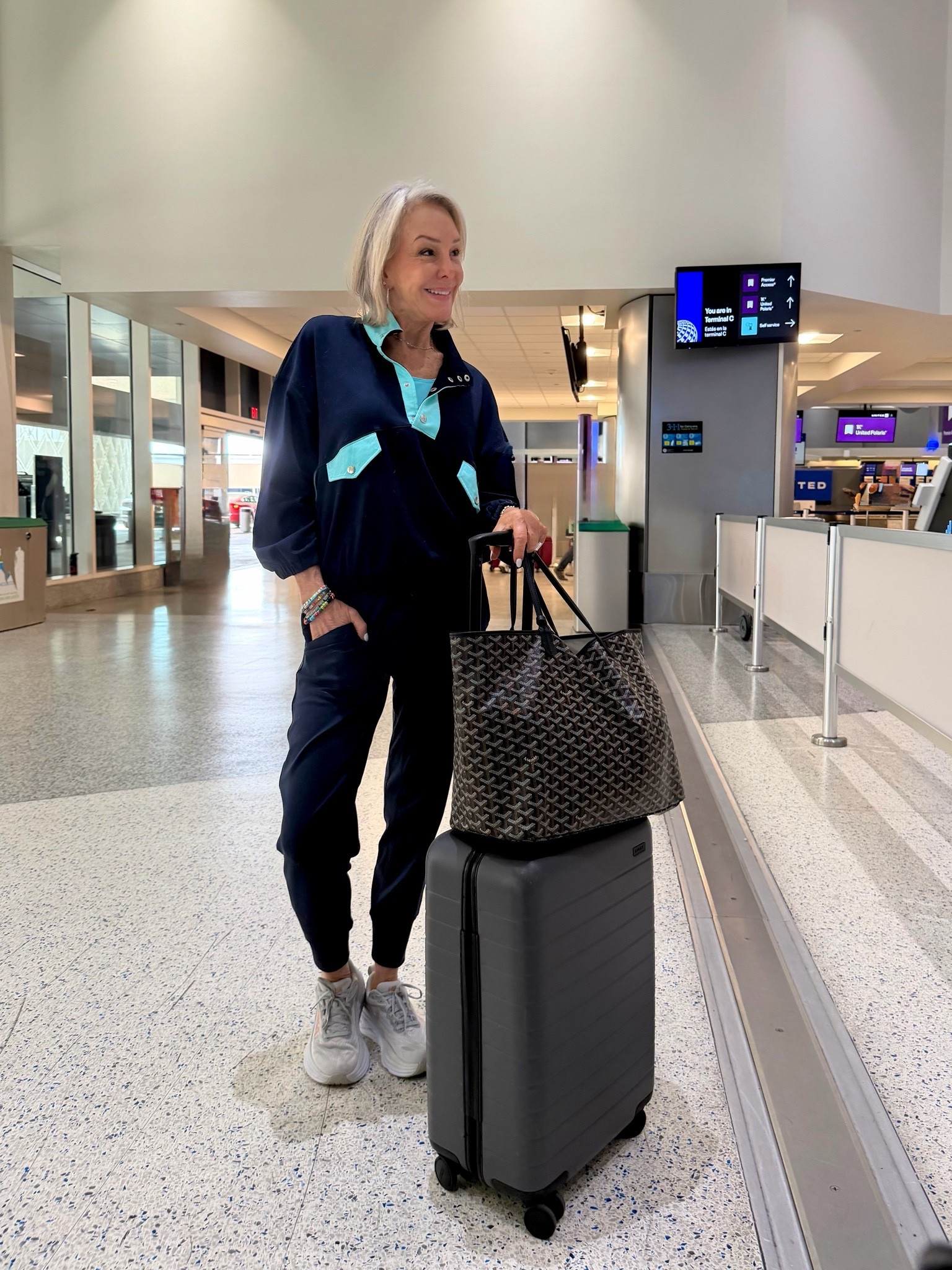 Workout Sets Short Athletic Set Activewear 2 Piece Outfits Pullover Sweatshirt and Shorts. Top comes with shorts. Pants a the best travel pants. 
Hoka sneakers are sooo comfy. 
My Away roll on bag is by far the best and I have tried about a dozen different bags.

#LTKOver40 #LTKTravel #LTKootd