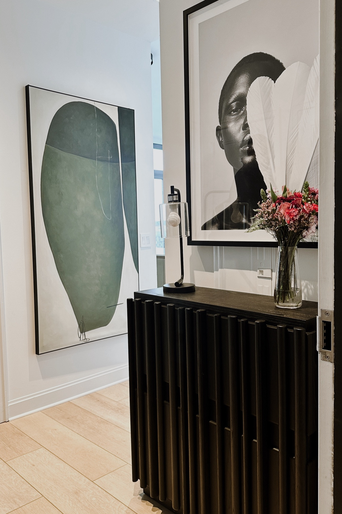 The black and white art piece is “Pretty Bird” from Houseofspoils.com