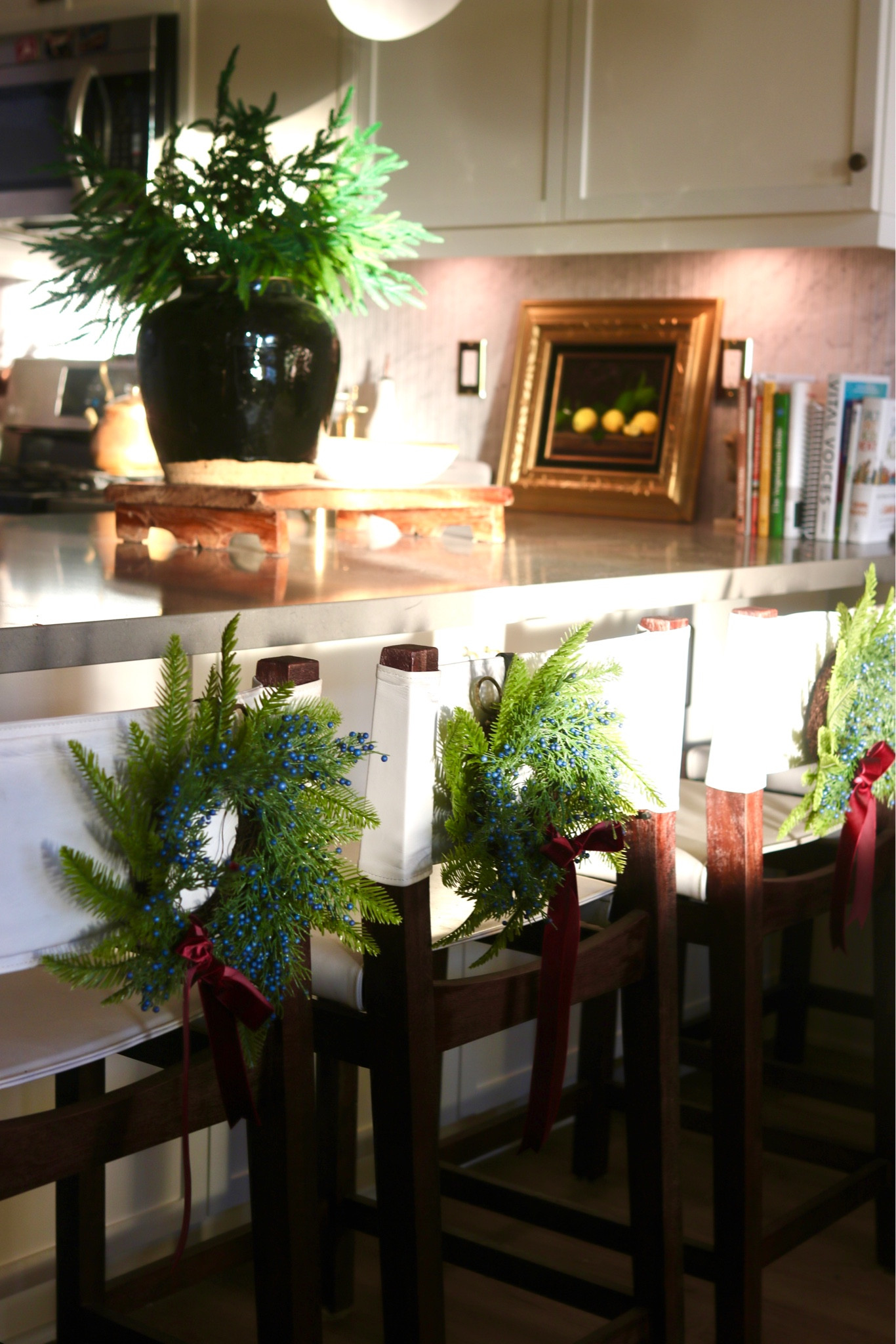 Mini Wreaths on the back of a counter-stool or barstool are the perfect way to add Subtle and classy holiday decor to your kitchen! #christmasdecorating

#LTKHoliday #LTKSeasonal #LTKstyletip