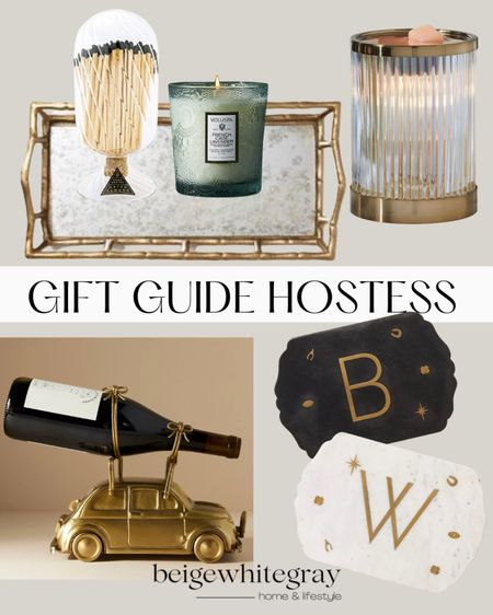 How beautiful are these gift ideas?! I love the high end looking target tray paired with the match cloche and voluspa candle!! And I think Anthropologie has the best gifts! I love this wine bottle stand with the marble trays personalized with an initial is just perfection! 

#LTKHoliday #LTKGiftGuide #LTKhome