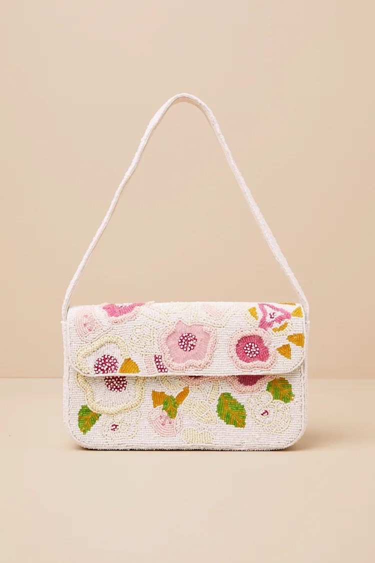 Celebrate spring with a beautiful Laurencia White Beaded Floral Shoulder Bag. This shoulder bag is under $50.

Keywords: Resort wear 2026, spring date, spring accessories, spring dress, spring handbags, floral handbag, floral clutch, spring crossbody bag, summer accessories, summer handbag, wedding guest, spring wedding guest, summer wedding guest, pearl bucket bag, leather handbag

#LTKootd #LTKWedding #LTKSpringSale