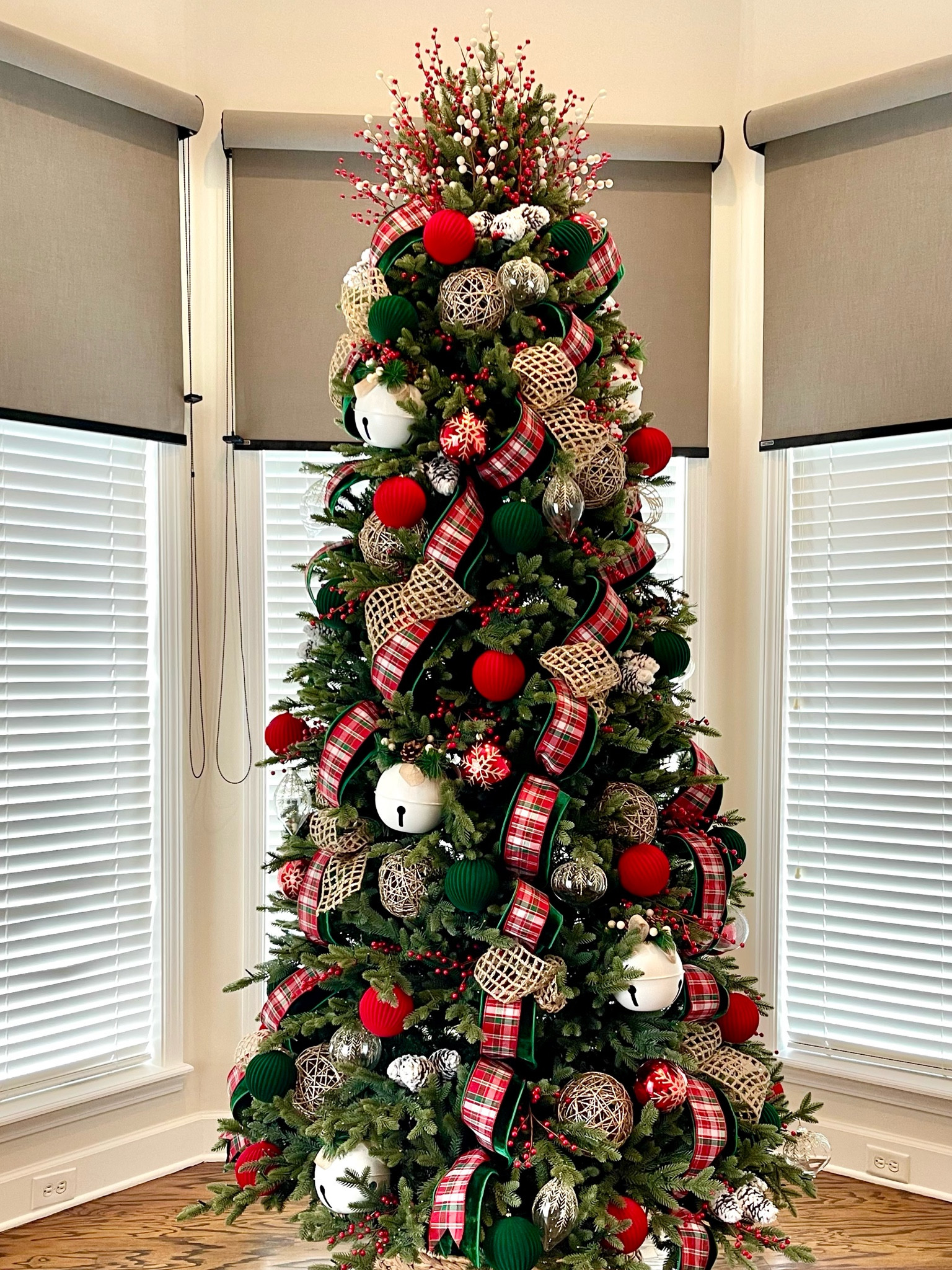 Traditional Christmas decor with a country flair. This is a 10’ slim tree with a wicker tree collar. 

Tip! Make sure you measure your stand before buying a tree collar. 

#traditionalchristmastree #traditionalchristmasdecor #redandgreendecor #rusticchristmas #christmasdecor
#LTKxWayfair 

#LTKSeasonal #LTKHome