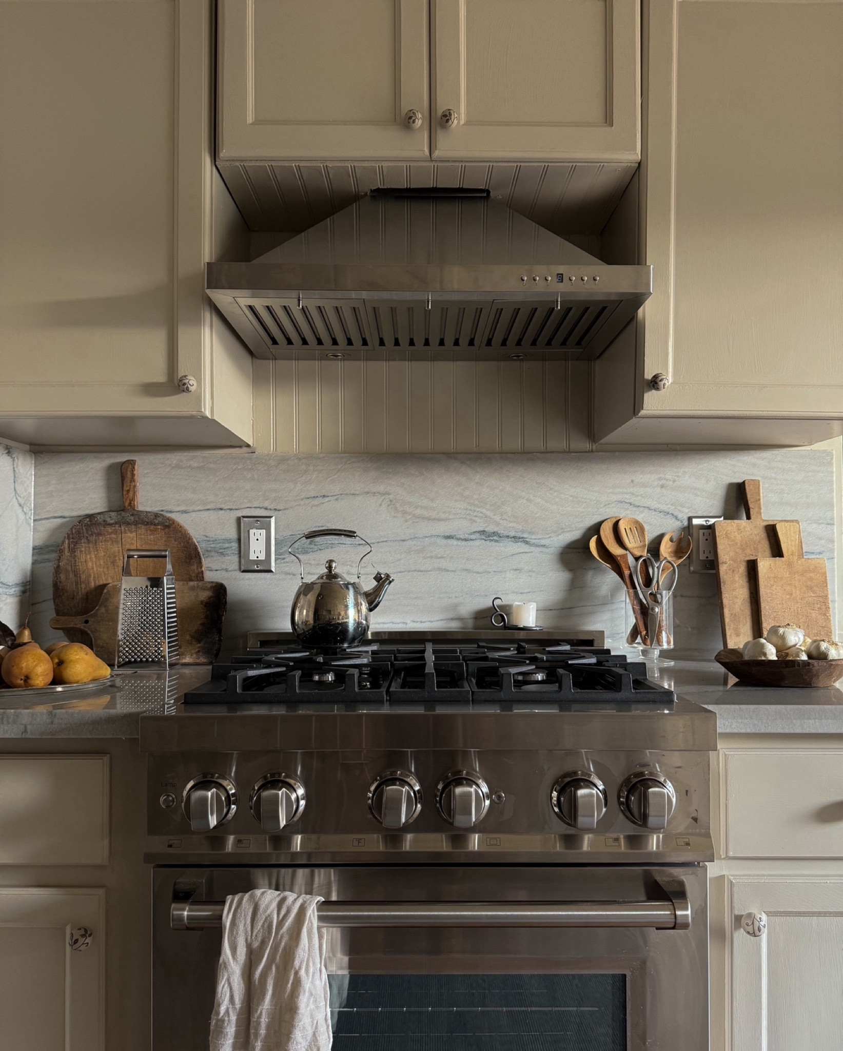 I feel like my range and range hood haven’t really had a moment on my feed, so here it is. 🫶🏽 

This DIY was the toughest one to work on in the entire kitchen. The original cabinets weren’t hung the best, and the whole setup was rinky-dinked (for lack of a better phrase). Took lots of time, math, adjustments, and design-resolutions to get this one right (and I still have a couple of things I’m going to fix later on). But for right now, I love this little spot - it makes me excited to come home a cook 👩🏾‍🍳. 

And for everyone asking about my range,  hood, cutting boards, and tchotchkes, I’m linking them here: 

#LTKhome