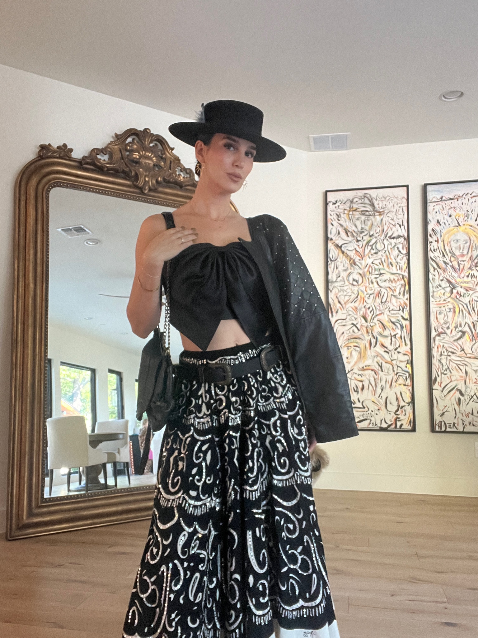Rocking a bold black outfit with a wide-brimmed hat, patterned skirt, and draped jacket to watch a show downtown with my hubby. It’s a mix of vintage style and modern fashion for a unique look.
#blackoutfitidea #partyoutfit #trendsetter #vintagevibes

#LTKSeasonal #LTKStyleTip #LTKParties