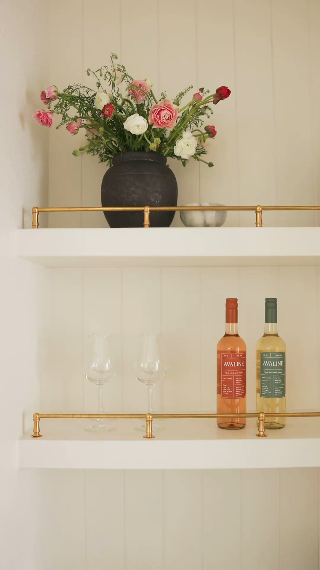 I know from personal experience that shelves are often the last thing to be styled. Bookcases, consoles, and floating shelves can be soo intimidating, but they don’t have to be! 

Here’s how I approach styling to get the perfect look every time!

1. Buy more than what you need - It’s all about curating, not overcrowding! HomeGoods, TheLifestyledCo, and Flamingo Rodeo (a local fave!) are my go-to’s for finding the perfect pieces for me and my clients. 

2. Group in odd numbers - I swear it’s the secret to effortless styling! For example, on the top shelf, I have 3 wine bottles, a vase, and a small bow, creating a group of 5. The bottom shelf has 3 groupings: red wine glasses, some Avaline wine, and coupe glasses. 

3. Vary your heights - Create balance by pairing tall pieces with shorter ones, and mirror your heights across shelves. 

4. Layer - If your shelves are feeling flat, add some depth by placing a frame behind a shallow bowl or add some fresh flowers. (Trader Joe’s is always the best for this!) 

If you love styling tips and home inspiration, make sure to follow us @cheyennepaigeinteriors. You can shop decor from this post and more at the link in my bio, and if you ever need recommendations, don’t hesitate to DM us!  

 #LTKHome #LTKFindsUnder50 #LTKFindsUnder100