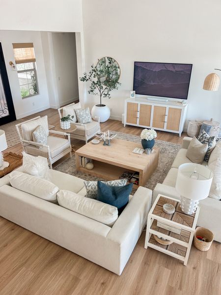 Our neutral living room with blue accents. Coastal decor, living room decor, living room furniture, pottery barn, crate and barrel, blue accents, coastal home, rattan, console table, target finds. 

#LTKhome