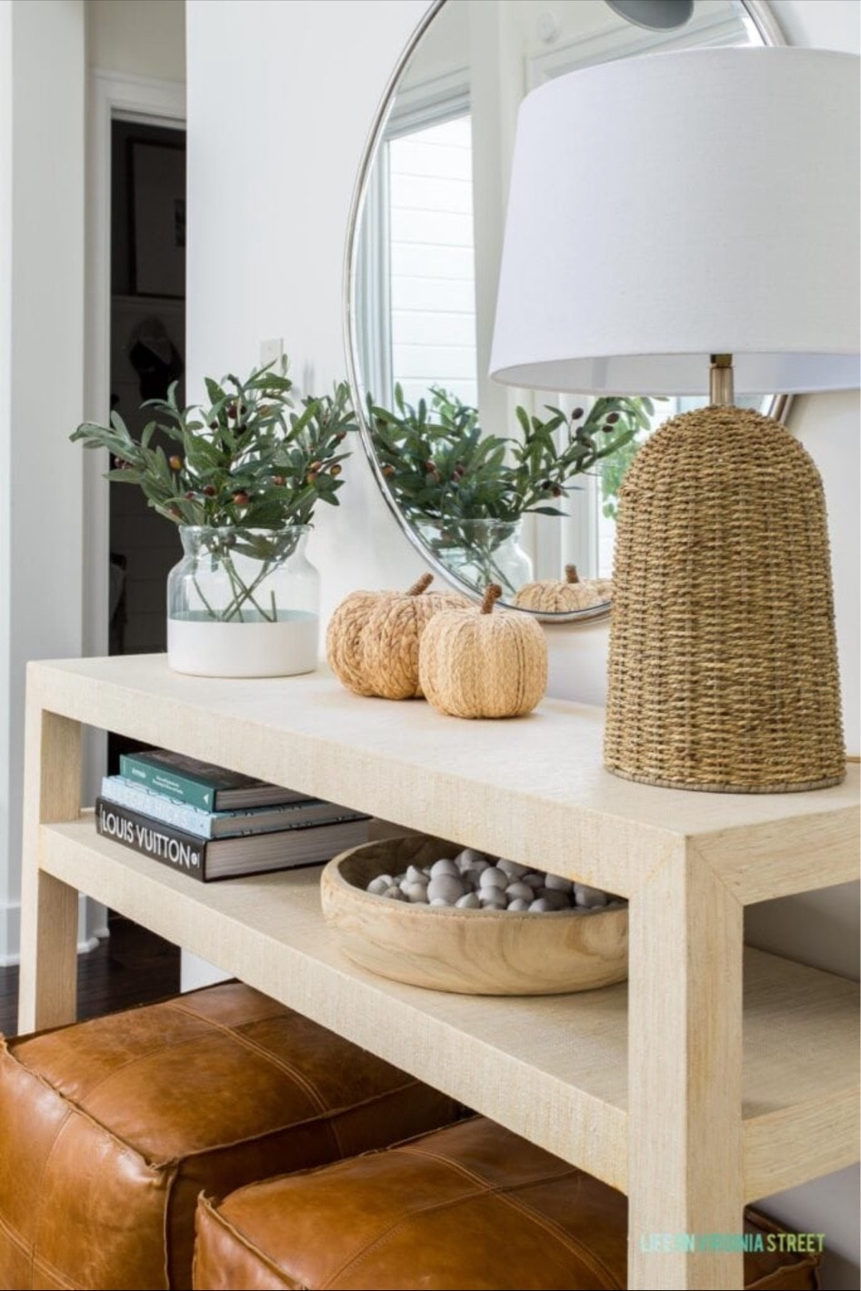 Our entryway is all decorated for fall! I’ve styled our raffia console table with a dipped painted vase with faux greenery, a wooden bowl with pebbles, woven pumpkins, brown leather poufs, a silver wall mirror, a swing arm sconce and a rattan table lamp!

entryway inspo, serena and lily, amazon finds, amazon home decor, pottery barn mirror, wall decor, entryway decor, hallway decor, hallway lights, entryway chandelier, hallway table, target finds, target home, hallway mirror, simple decor, round wall mirror, wall sconce, coastal decorating, coastal design, coastal inspiration, wall decor, entryway decor, entryway light, amazon home finds, pb inspired

#LTKunder50 #LTKunder100

#LTKhome #LTKSeasonal #LTKstyletip