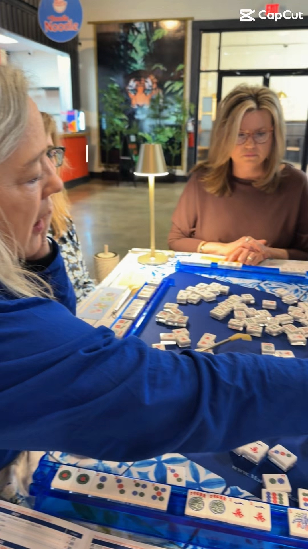 So obsessed with this game!! I knew I would be because I’ve wanted to learn to play for over a year! It was on my bucket list for my 60th birthday this year!! I have checked it off!! Still a lot to learn…but oh so fun!! #mahjong #mahjongtiles #mahfriends @Oh My Mahjong @Main Street Mahjong

#LTKdayinmylife #LTKstorytime #LTKvlog