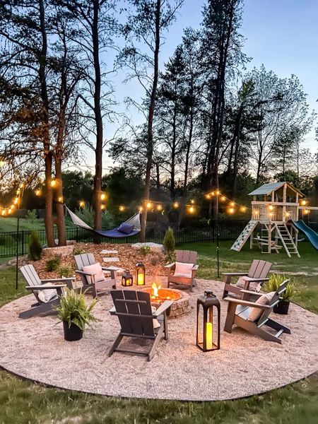 The coziest patio setup featuring Adirondack chairs and string lights!   

#LTKHome
