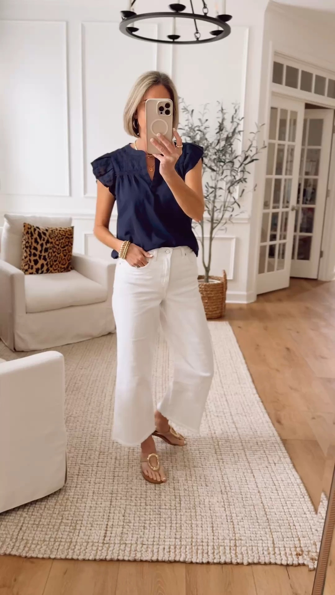 Love the feminine details on this top - little ruffle sleeve and eyelet details. Wearing a size small. The cutest raw hem on these wide leg cropped white jeans. Wearing 27 could have sized up to 28 

@ltk #buffalojeans #wearedenim 

#LTKSpringSale #LTKSaleAlert #LTKootd
