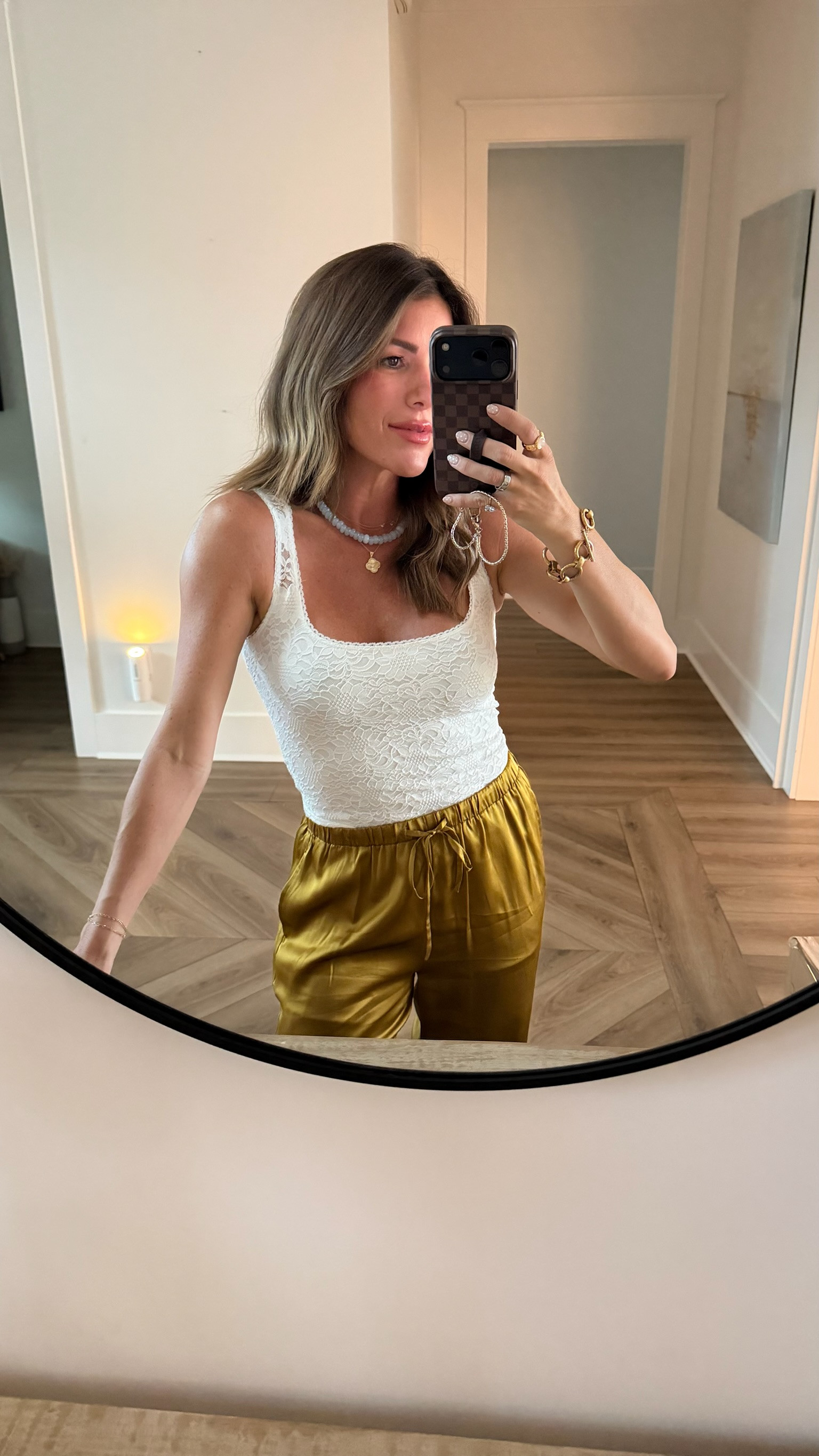A feminine lace tank and silky wide leg pants make the perfect elevated late-summer pairing.

lace tank top, satin pants, wide leg pants, olive pants, summer outfit, early fall outfit, transitional style, feminine outfit, chic casual, elevated basics, date night outfit, dinner outfit, classy casual, polished outfit, effortless style, summer evening look, fall transition outfit, neutral style, everyday chic, late summer style 

 #LTKootd #LTKOver40 #LTKPetite