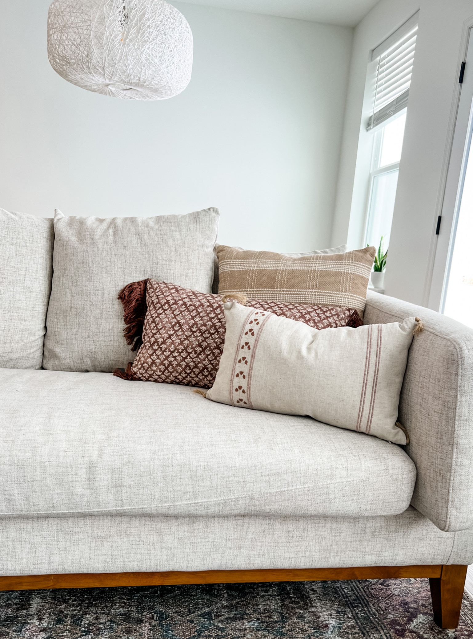 My new throw pillows! Target Threshold Studio McGee. Neutral throw pillows. West Elm chandeliers. World Market couch, sofa. Living room decor. Living room furniture. 

#LTKhome #LTKunder50 #LTKsalealert