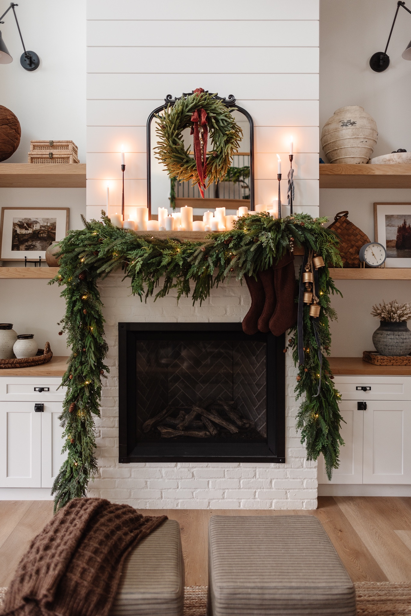 Our Christmas mantle 2023 and she’s a stunner if I do say so myself. 😍 She took a while to put together, the photos/video don’t really do it justice. Let me know in the comments if you’d like a tutorial on how you can achieve this same look!  YES, LTK has comments now!! 

Christmas decor, mantle decor, holiday decor, Christmas mantle, mirror, candles, ottoman, wall sconce, bells, stockings, garland, holiday stems, holiday garland, mcgee and co, studio McGee #LTKhome #LTKHoliday

#LTKSeasonal