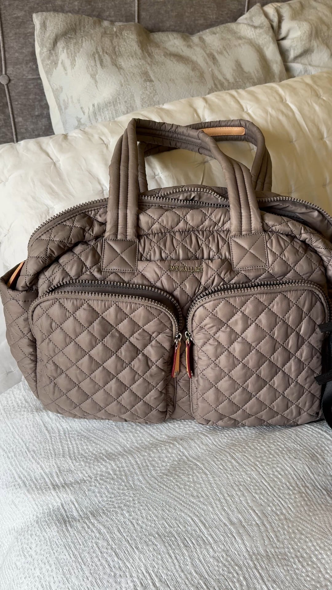 Chic & functional travel bag. If you are in the market for a new one, I highly recommend this nee style that looks good and works out perfectly for travel. 
- Lightweight, well thought out organizational details, can fit under airplane seat. 
- Shoulder or crossbody carry; plus sleeve to put on top of rolling luggage. 
- Quality of bag is excellent. 
- Available in multiple colors; exact color here is morning dove. 
- Travel outfit: athleisure style. 
- Travel shoes: comfy sneakers. 
- Mini bag is a convertible bag that I’ve used for recent vacations. 


#LTKTravel #LTKItBag #LTKOver40