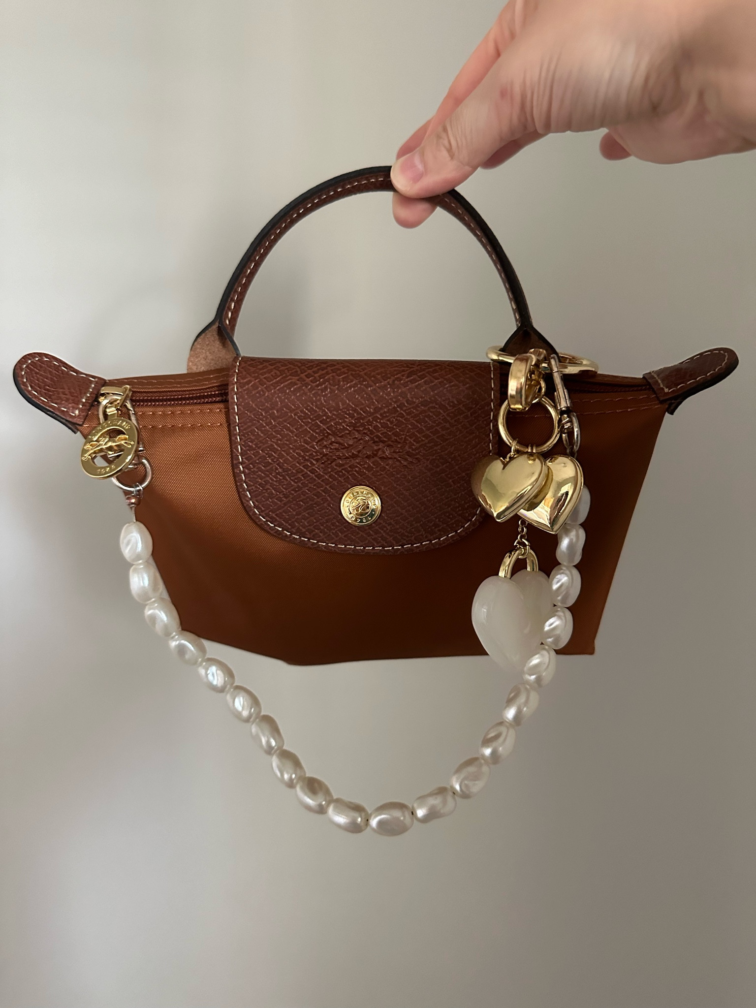 This bag is already so cute, but I love the bag charms added to it!! 