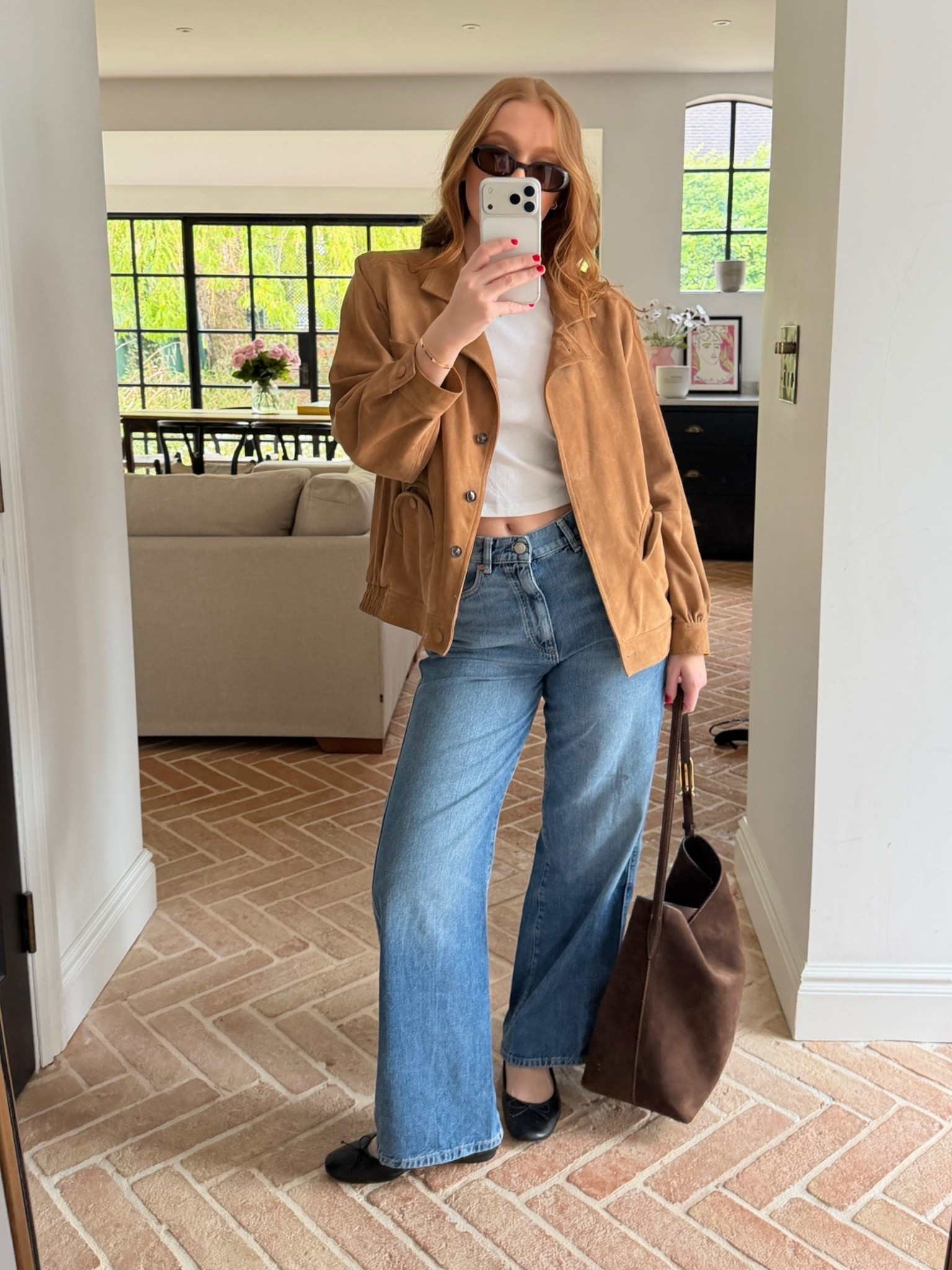 suede jacket / tan suede / wide leg jeans / white crop tee / chocolate tote / black ballet flats / mini sunglasses / mirror selfie / GRWM / going out outfit / spring outfit / effortless style / model off duty / cool girl aesthetic / Laura Harrier style / Pinterest outfit / quiet luxury / neutral tones / brown tones / mum’s wardrobe / stealing from mum

#LTKspring #LTKsale #LTKjeans