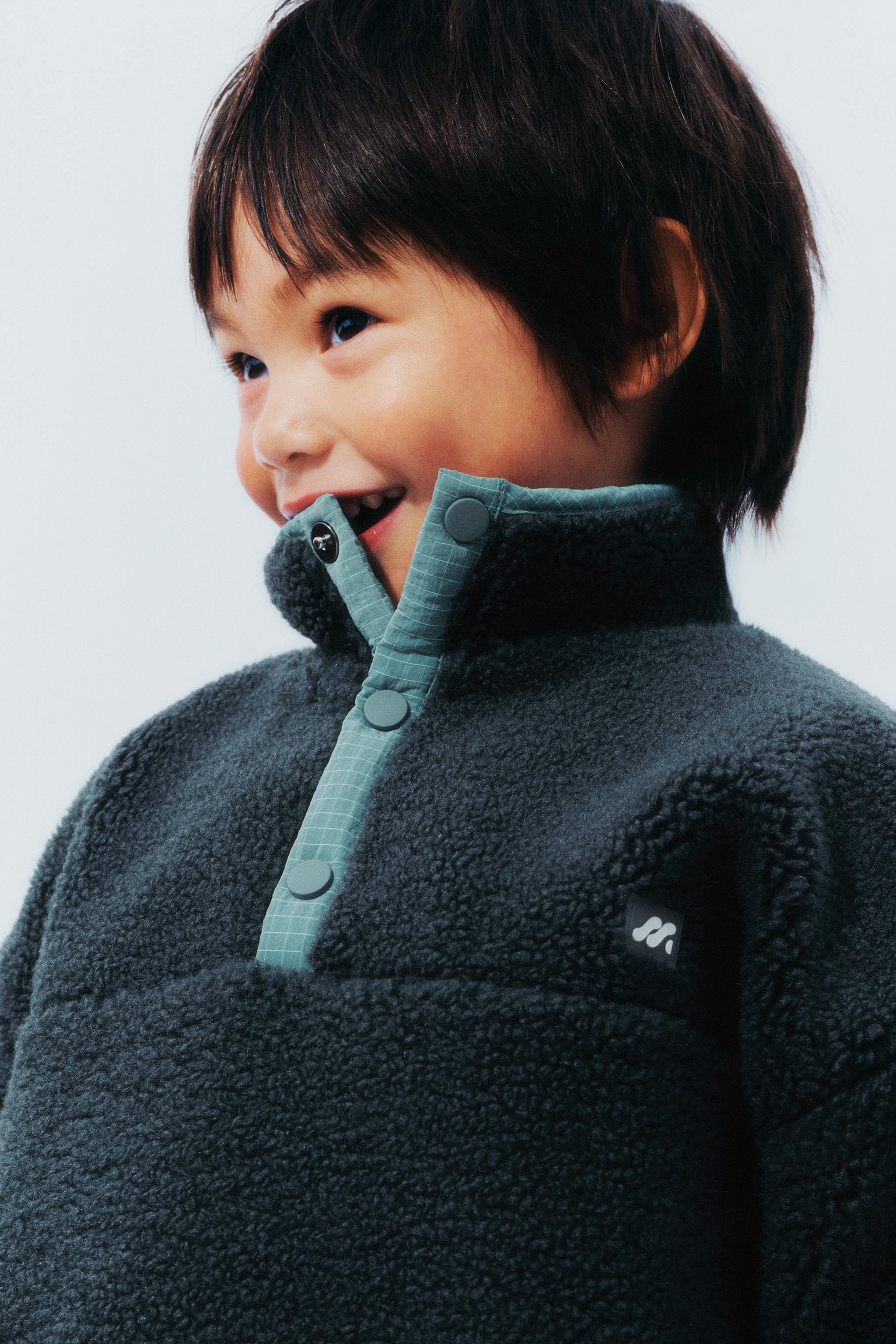 FAUX SHEARLING SWEATER WITH RUBBERIZED LOGO | Zara US