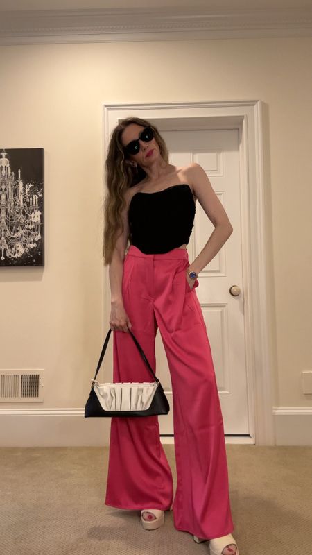 Hot pink trousers with black corset top for a chic Barbie inspired look that is perfect for summer events! My slides are 15% off with code ziba15 ❤️‍🔥

#LTKsalealert #LTKunder50 #LTKshoecrush