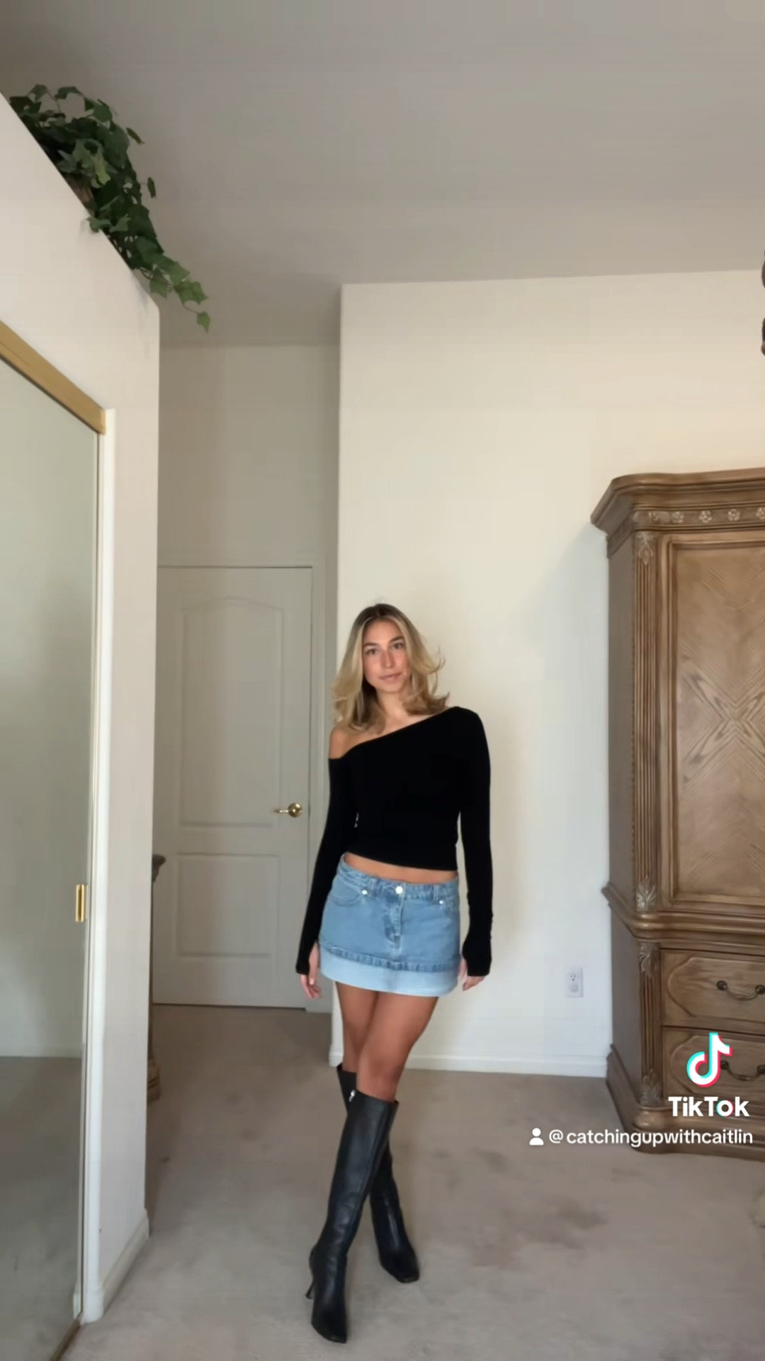 Fall outfit, fall style, long sleeve top, asymmetrical top, black top, denim mini skirt, mini skirt, black boots

#LTKstyletip #LTKVideo