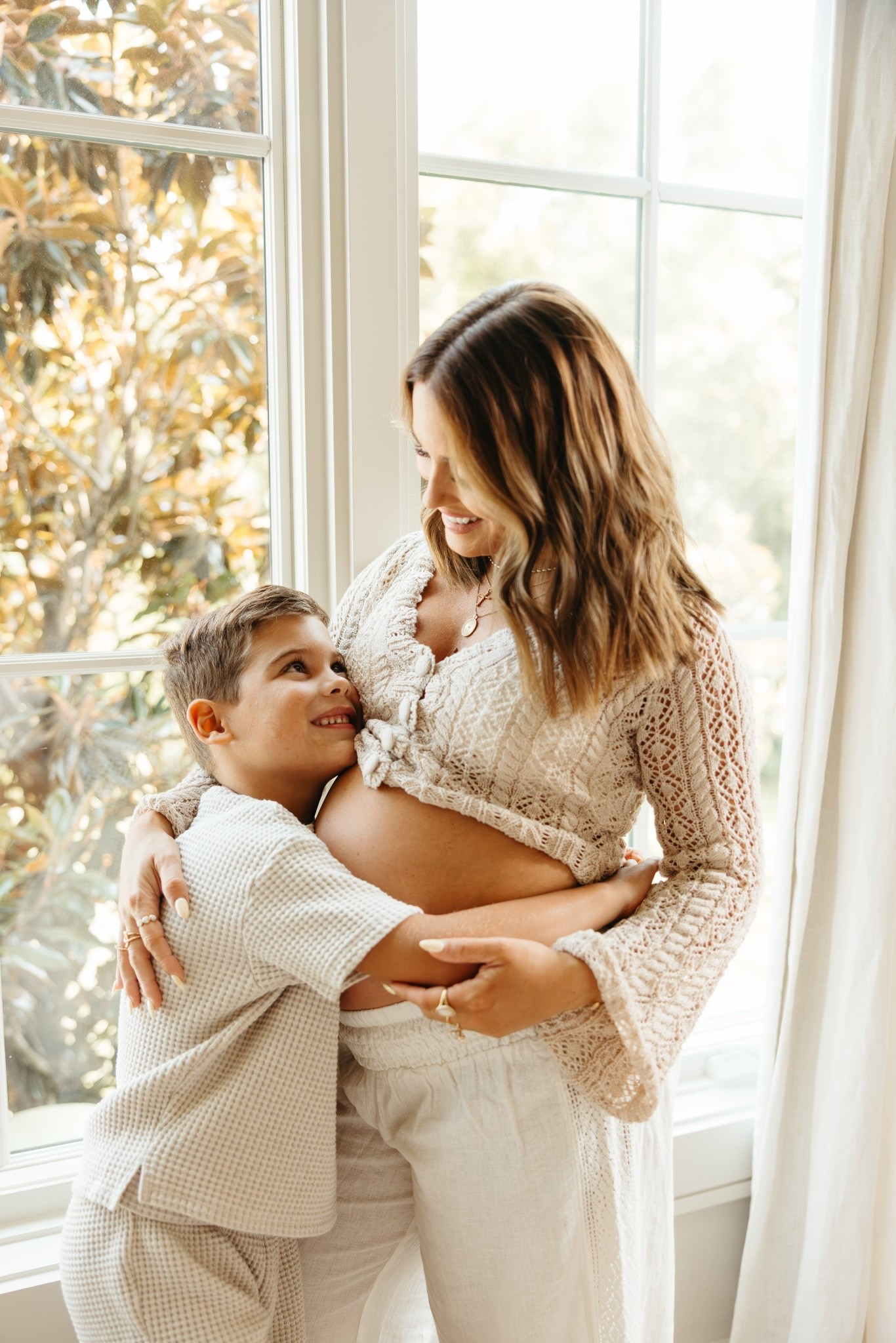 Knit cardigan (small) and white pants (small). I wanted to shoot some photos of our family in our bedroom- just snuggly and cuddly. I felt like this was a perfect outfit that fit those vibes.

#LTKgrwm #LTKBump #LTKmomlife