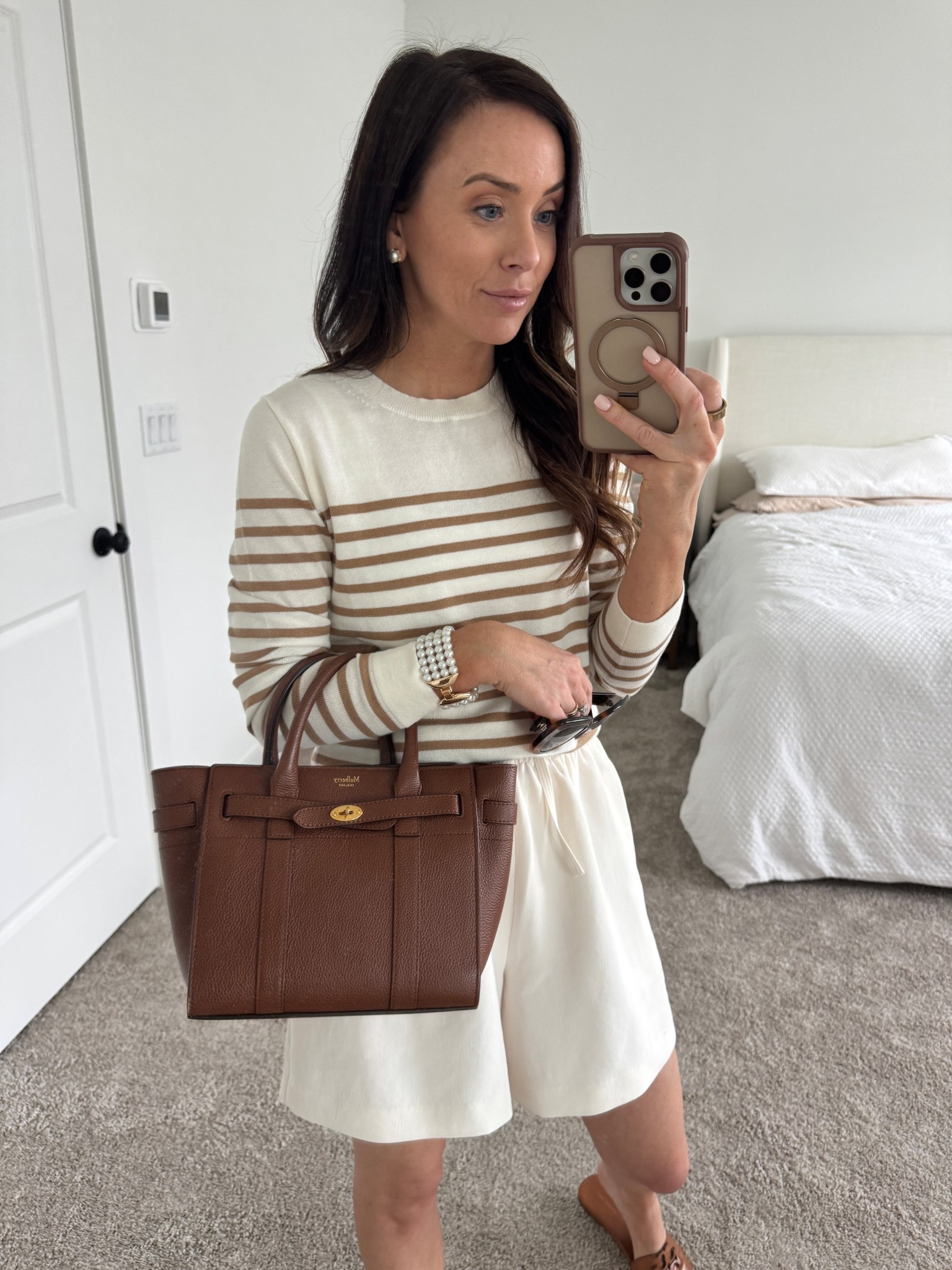 white neutral outfit, stripe sweater, striped top, brown handbag, aritzia crepe lodge short, aritzia shorts, white shorts 

#LTKOver40