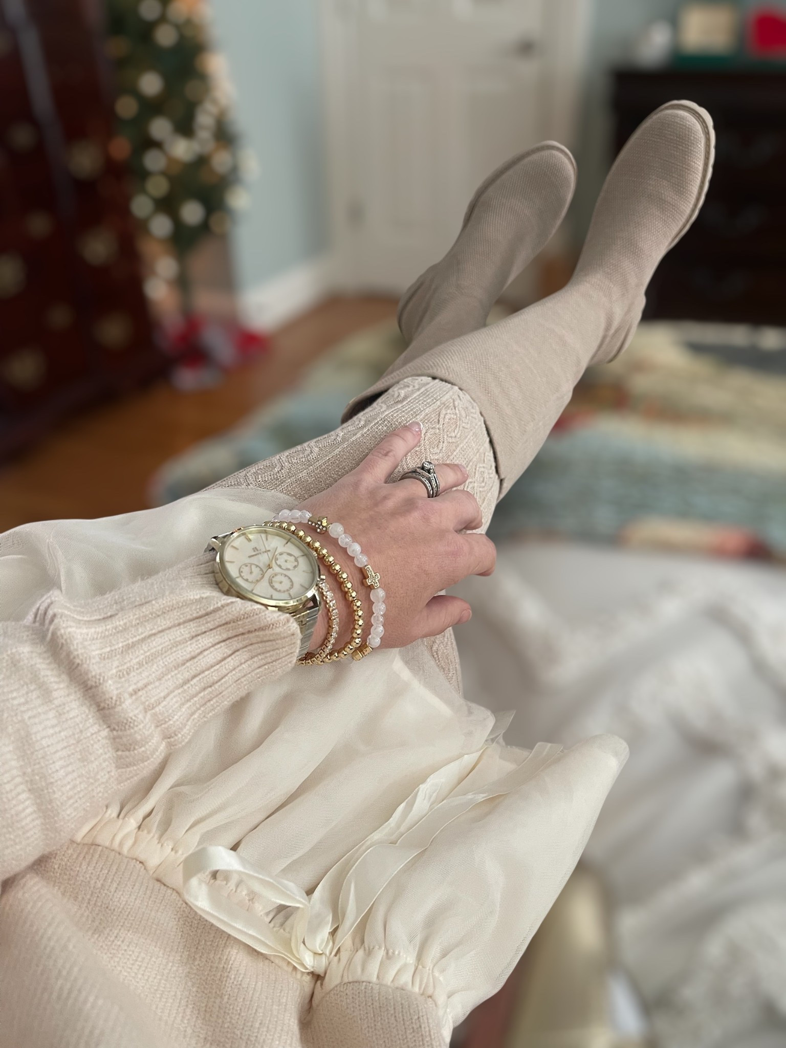 Cozy Winter Neutrals for the Holidays 🤍✨

The sweetest neutral winter outfit — soft, comfy, and so feminine for the season. This turtleneck tulle mini dress pairs perfectly with my cable sweater tights and the coziest knee-high wool boots for a dressed-up but still snuggly holiday look. I added a simple bow headband and my everyday jewelry stack to keep everything classic and polished.

My BaubleBar bracelets are still only $10 right now (usually $30–$45!) and make the perfect stocking stuffers or teacher gifts. The gold pearl-link watch is one of my most-worn pieces and elevates any outfit, even a cozy one like this. Soft textures, creamy tones, and a little sparkle — such an easy winter outfit formula.

Holiday styling inspo: neutral winter outfit, cozy holiday look, Amazon sweater dress, cable sweater tights, knee-high boots, feminine neutral outfit, $10 BaubleBar bracelets, stocking stuffer jewelry, gold watch stack, soft glam holiday style, winter neutrals aesthetic.

#LTKHome #LTKGiftGuide #LTKCyberWeek