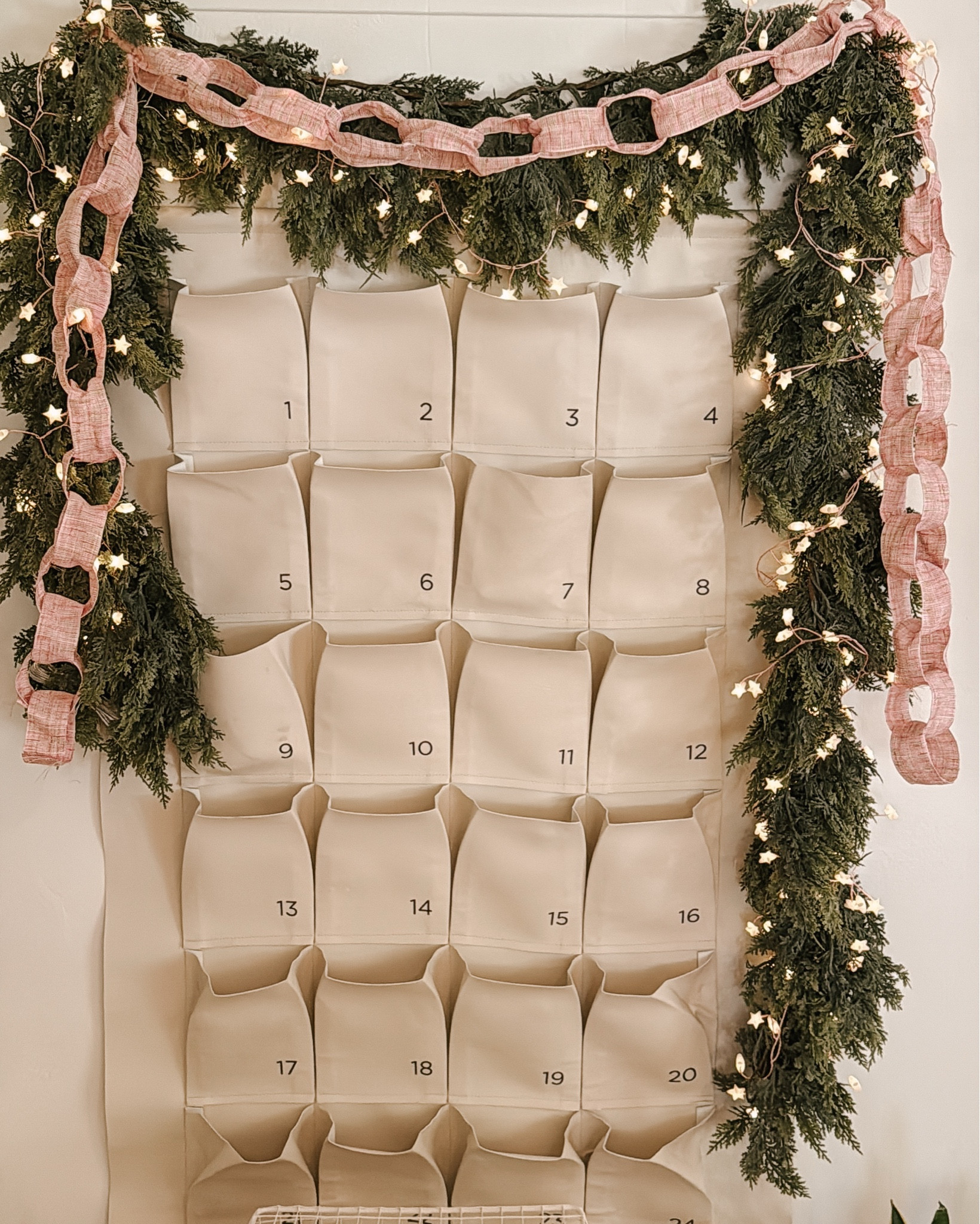 This garland is doing all the heavy lifting ✨
Faux cedar + twinkle lights + a pink ribbon chain = instant cozy holiday magic.
Linked the garland, star lights, and ribbon I used — perfect for mantle decor, wall installs, or advent displays!

#LTKHoliday #LTKHome #LTKSeasonal
