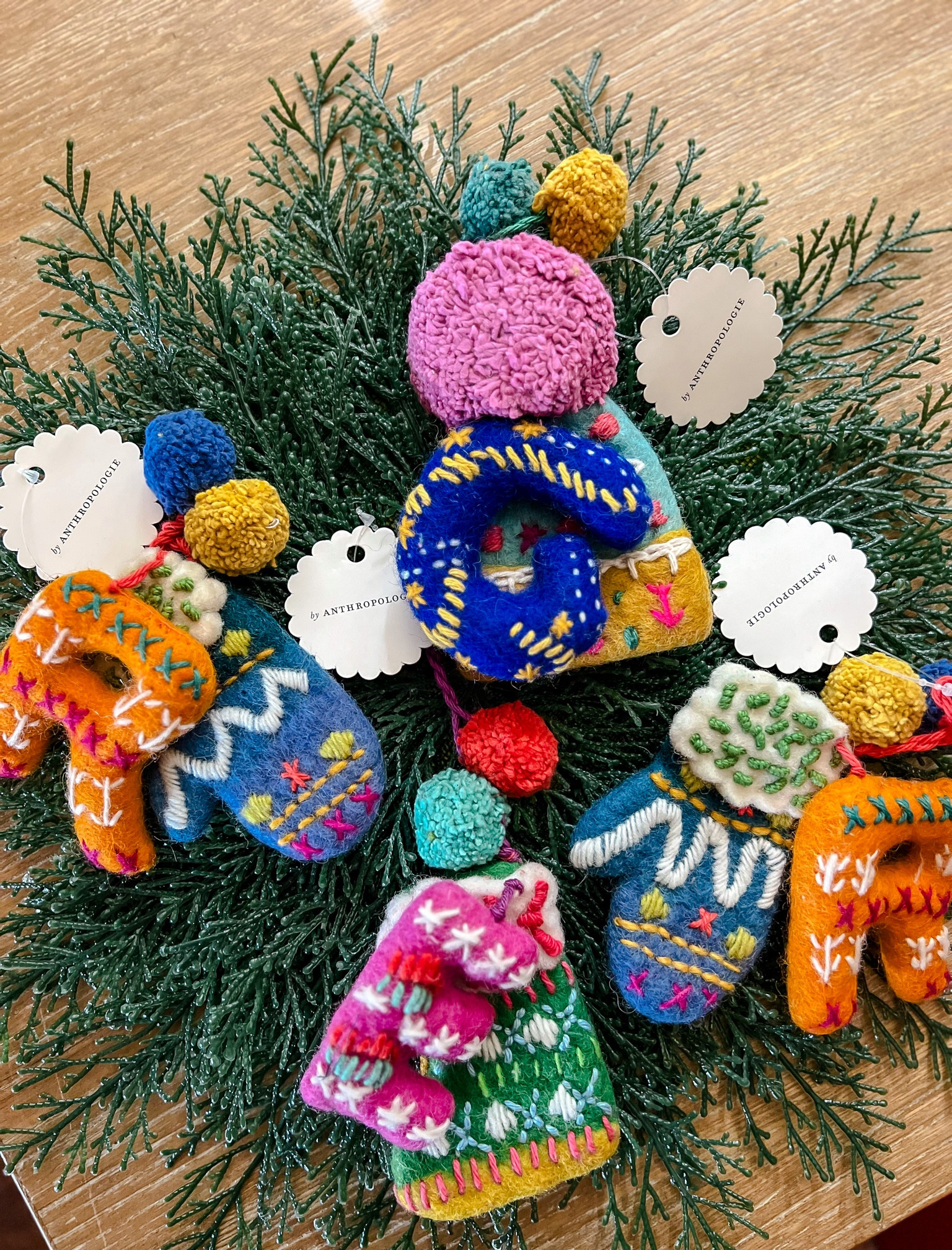 Anthropologie home - Après Ski Monogram Ornament. Perfect personalized kids friendly Christmas tree ornaments. They’re made in Nepal and I love them! Anthro living home. Christmas decorations. Amazing Christmas gift. Gift for her. Gift for him. 
Round top faux cedar table placemat from Kirkland’s home. Cedar Leaves Placemat. 

#christmas #anthropologie #kirklands #ornament #christmastree #gabrielapolacek

#LTKGiftGuide