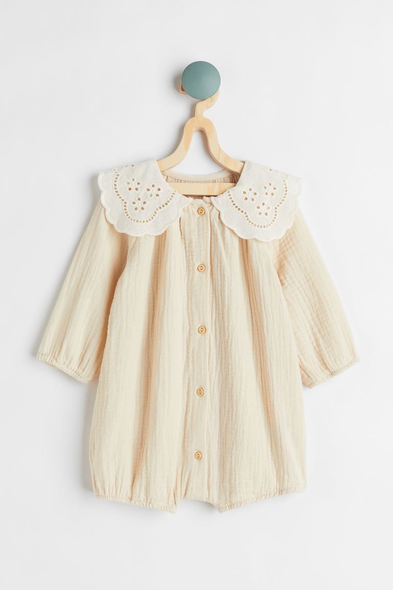 Conscious choice  New ArrivalBaby Exclusive. Romper suit in airy, woven cotton fabric. Rounded, s... | H&M (US + CA)
