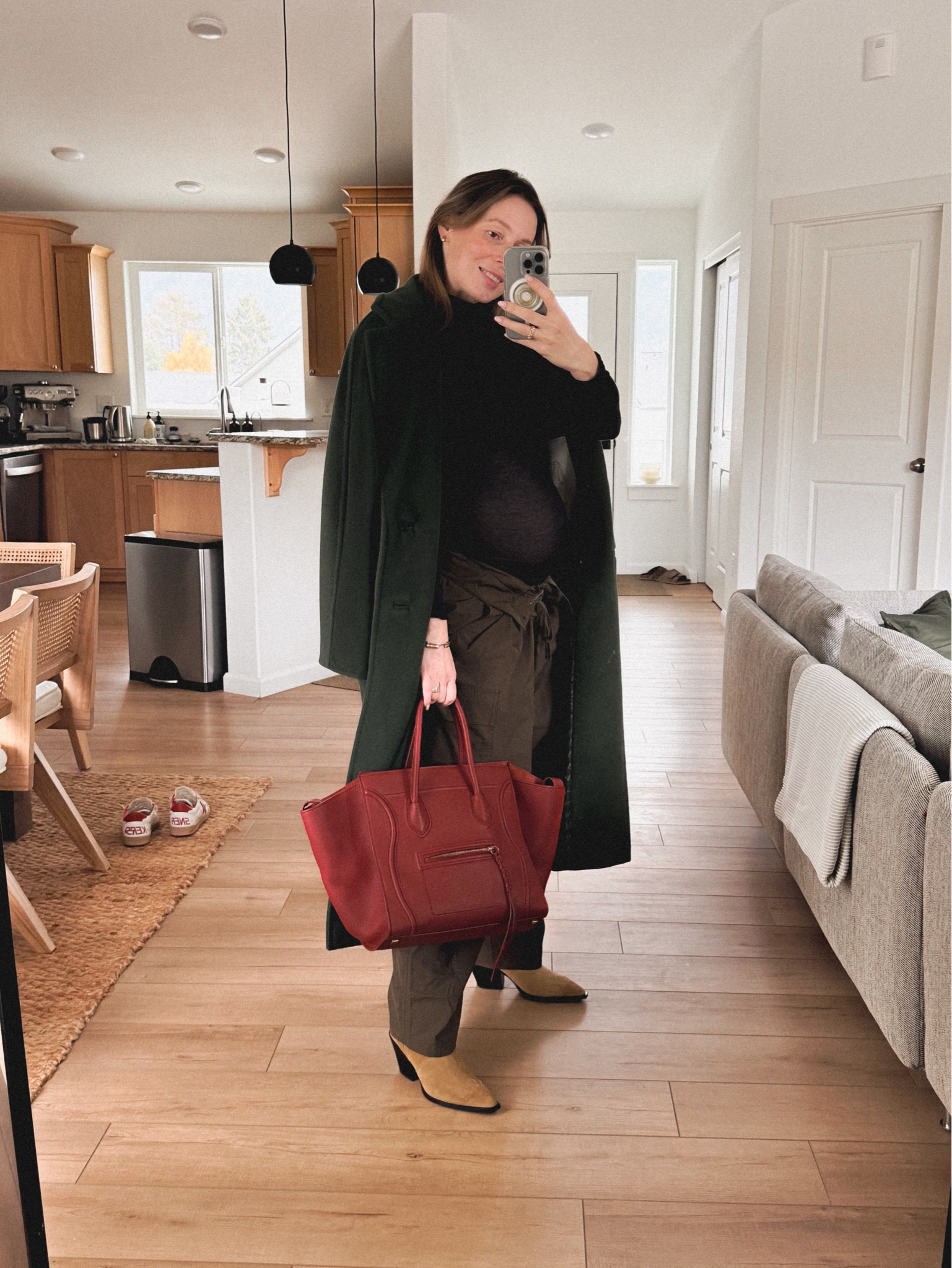 29th week pregnancy OOTD: 
Cargo Pants (Rebecca pants by Isabel Marant Etoile in khaki, similar: COS UTILITY BARREL-LEG PANTS) + Aeyde Ariel boots + Celine luggage phantom bag (in coquelicot (poppy) red) + Cos turtleneck + Max Mara 101801 Madame icon coat in green. 

#LTKSeasonal #LTKSaleAlert #LTKStyleTip