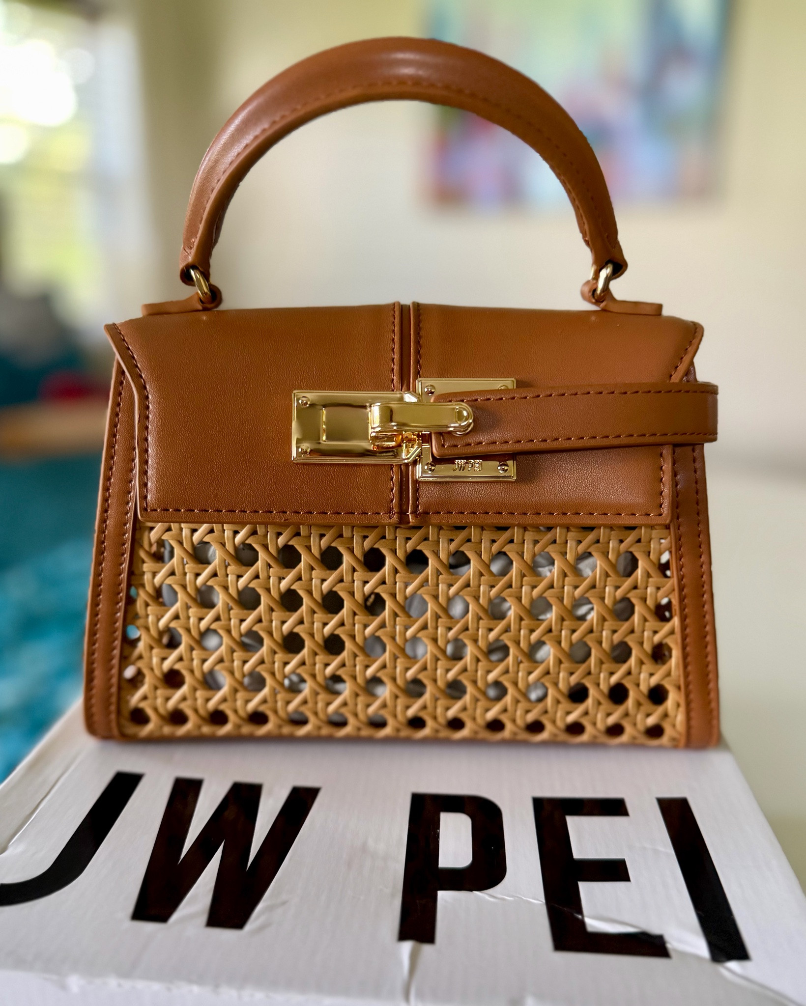 This little bag had no business being this cute. The woven detail, structured shape, and gold hardware already had me, but of course I had to add a few charms and make her mine.

Bag linked! Accessories links coming soon.

#LTKgrwm #LTKTravel #LTKSaleAlert