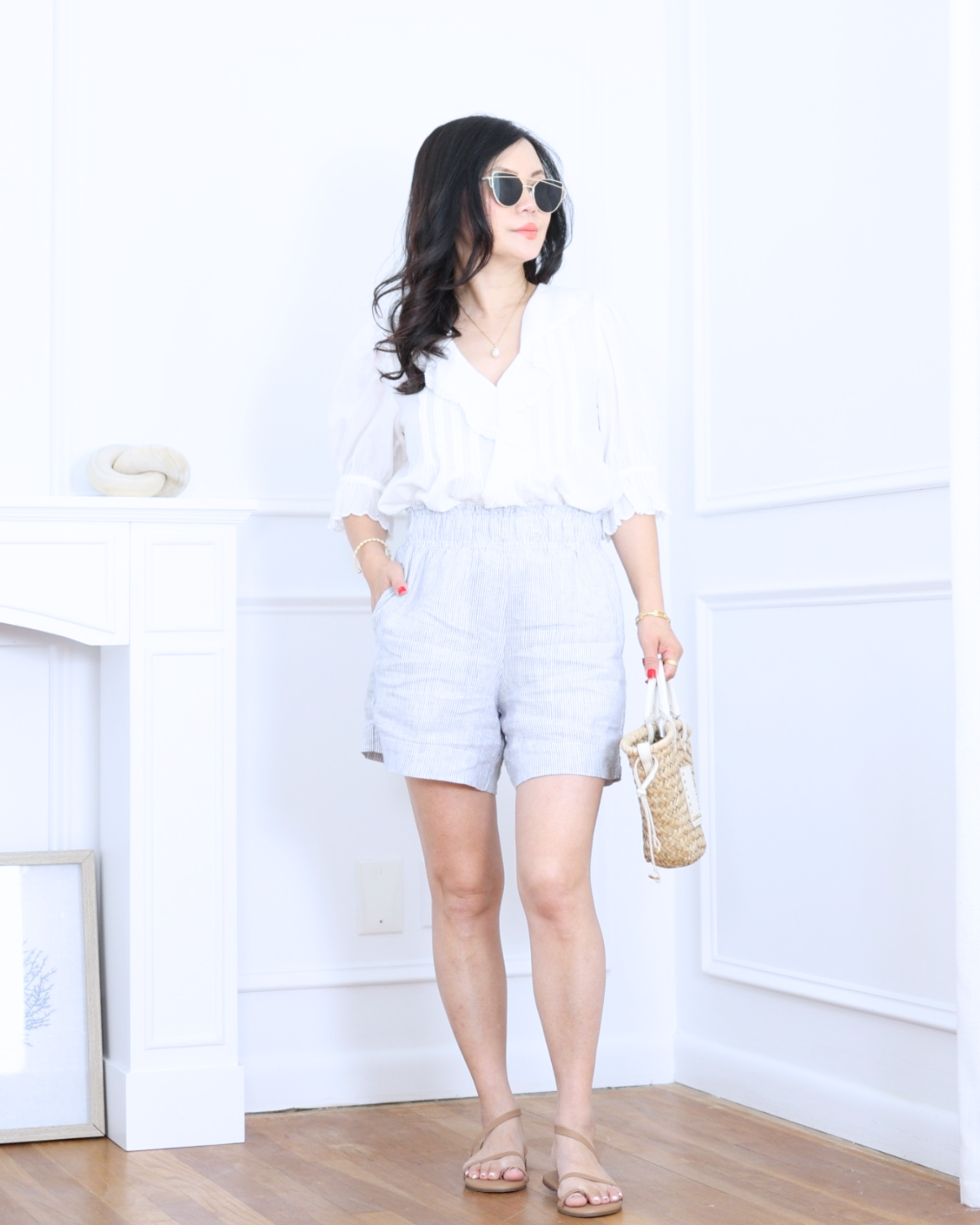 White top from Madewell paired with striped shorts from Quince — fresh, easy, and effortlessly stylish. A simple warm-weather look that feels relaxed, comfortable, and ready for sunny days ahead. I'm 5'2, wearing size S. 

 #LTKootd #LTKOver40 #LTKPetite