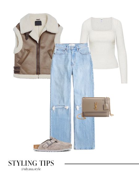 A faux shearling vest paired with ripped light wash jeans, a long sleeve top, clogs, and a handbag makes a cozy fall / winter outfit idea. 
.
.
.
.
.
.
.
Fall outfits | winter outfits | vest outfits | brown vest | fall vest | faux leather vest | Sherpa vest | jeans outfit | Abercrombie jeans | jeans curvy  | casual jeans outfit | high waisted jeans | straight leg jeans | straight jeans | Birkenstock clogs | fall outfits | fall shoes | fall fashion | fall tops | basic tops | designer bags | fall bags | casual fall outfits | casual winter outfits | 
#LTKCyberWeek 
#LTKHolidaySale #LTKGiftGuide #LTKSeasonal #LTKFind #LTKunder50 #LTKunder100 #LTKHoliday #LTKU #LTKsalealert #LTKfindsunder50 #LTKfindsunder100 #LTKstyletip #LTKworkwear #LTKtravel #LTKshoecrush #LTKitbag 