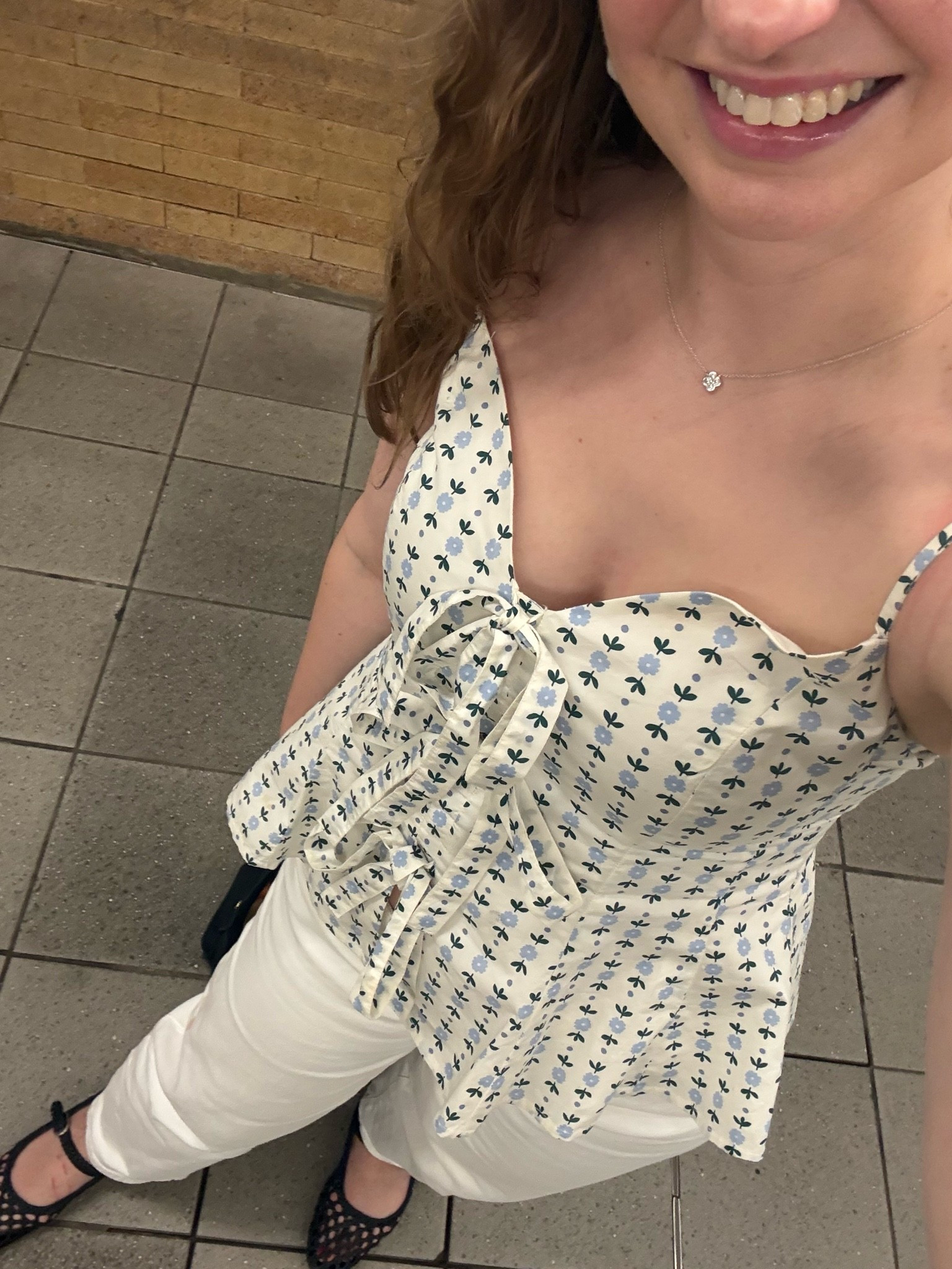 This floral bow-front peplum tank from Loft is on crazy sale right now with all sizes still in stock! Wearing an XS.

#LTKootd