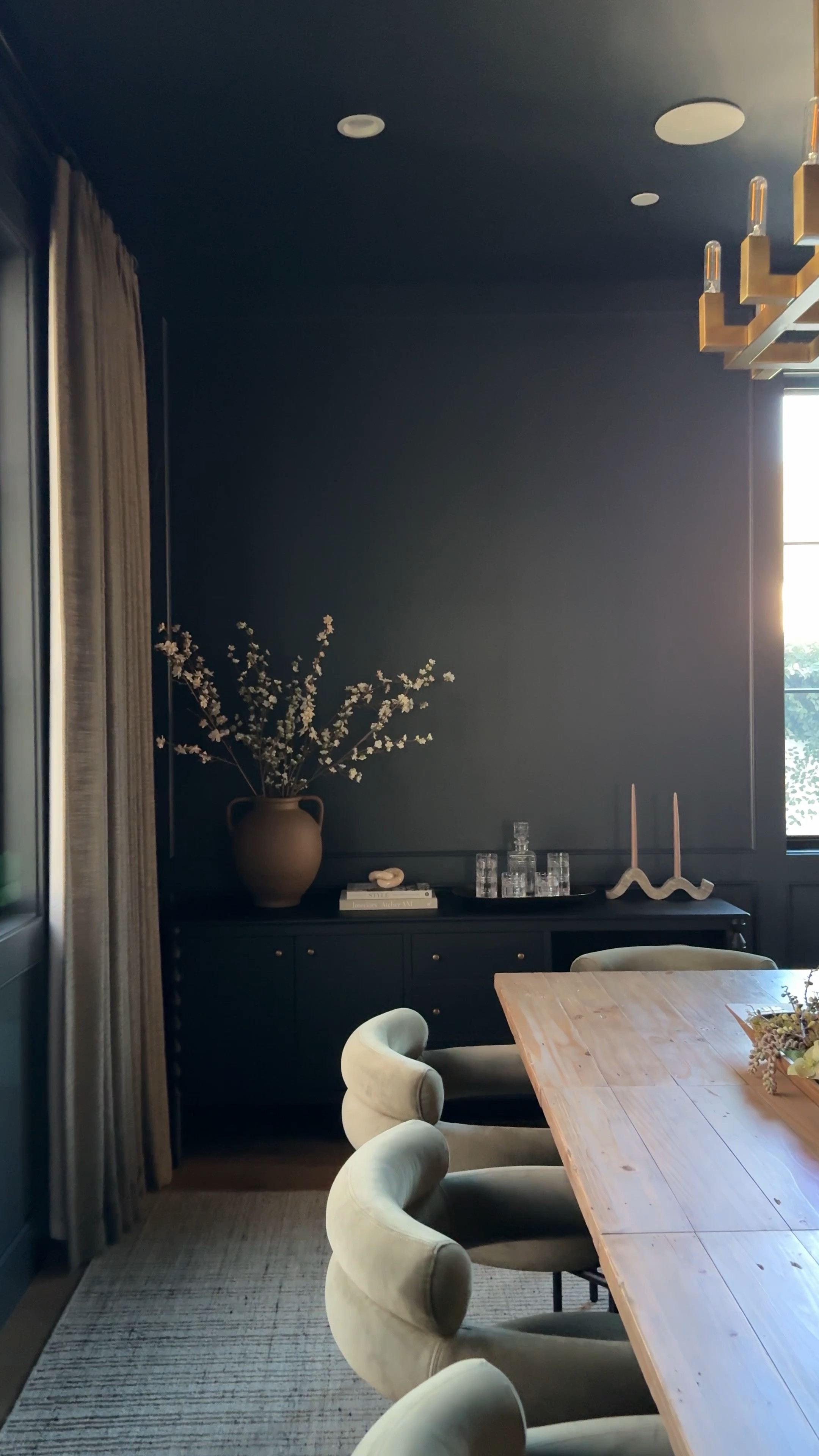 Dining room styling, green, dining chair, brass chandelier, brown vase, branches, white flowers, green branches, dough bowl, black console table wood console table sideboard buffet curtains drapes grey rug Lulu and Georgia McGee and co studio McGee 

#LTKfindsunder100 #LTKhome #LTKSpringSale