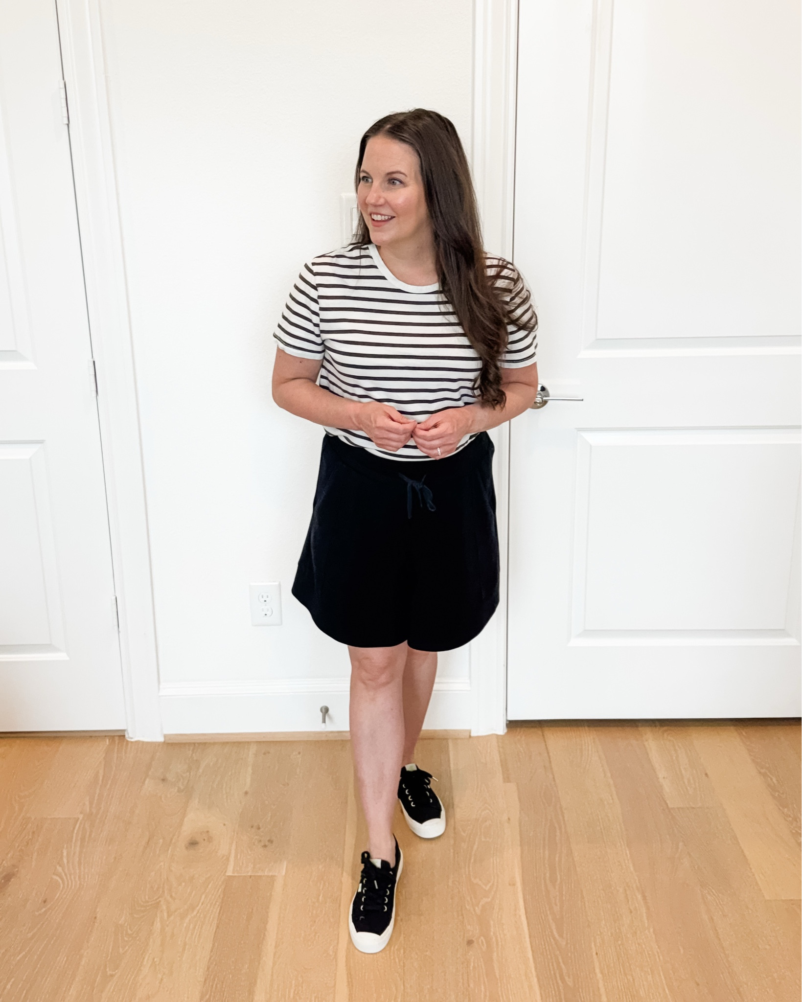 Easy summer outfits are my go-to this time of year. This casual mom outfit combines a classic striped top with comfy drawstring waist black lounge shorts and black sneakers for a look that’s comfortable, practical, and still put together. Whether you’re running errands, chasing little ones, heading to the airport, or sightseeing on vacation, this is the perfect vacation outfit you’ll reach for again and again. These black lounge shorts are lightweight, versatile, and an everyday summer staple that pairs with everything in your closet.

#LTKSeasonal #LTKPetite #LTKOver40