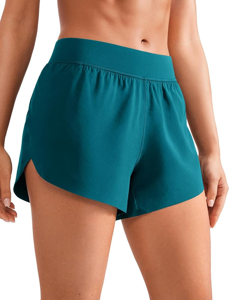 CRZ YOGA Mid Waisted Dolphin Athletic Shorts for Women 4" Lightweight High Split for Gym Workout ... | Amazon (US)