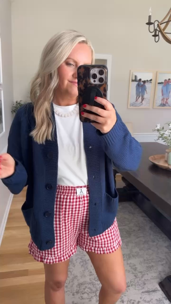 This little cardigan and gingham shorts combo feels like the kind of outfit you throw on for coffee runs, lake weekends, backyard BBQs, and everything in between. The navy and red combo gives such a classic Americana feel without looking too themed, and the lightweight cardigan is perfect for chilly restaurants or late summer nights.

Americana outfit, Memorial Day outfit, Fourth of July outfit, gingham shorts outfit, navy cardigan outfit, summer layering outfit, casual mom style, comfy summer outfit, red white and blue outfit, lake weekend outfit, classic summer style, easy everyday outfit, lovelylifestyling

#LTKSeasonal #LTKOver40 #LTKootd