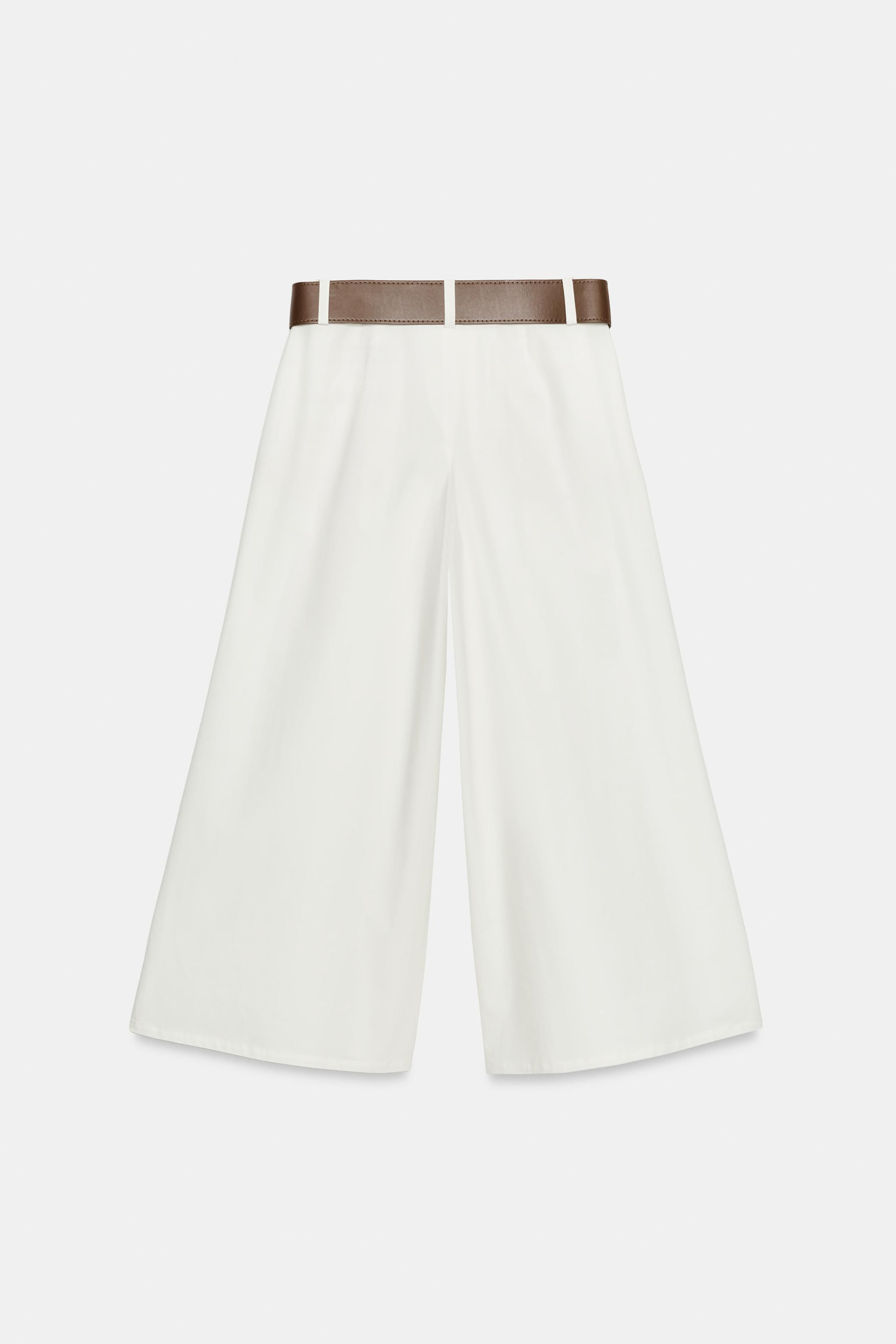 High-waisted pants with pleats and front pockets. Wide belt detail. Cropped wide-leg fit. Hidden ... | Zara US